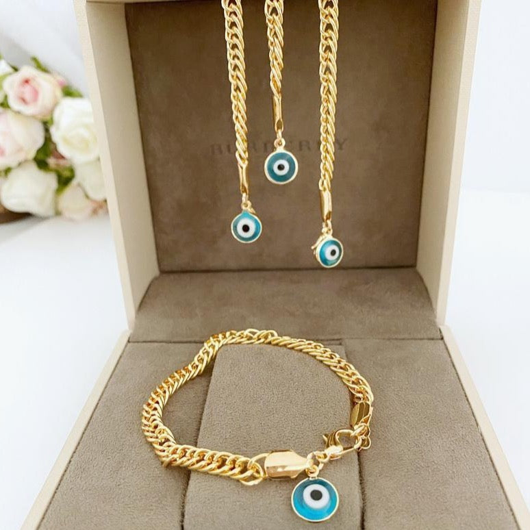 A beautiful Blue Evil Eye Bracelet featuring handmade blue beads and a chunky gold chain, symbolizing protection and good luck.