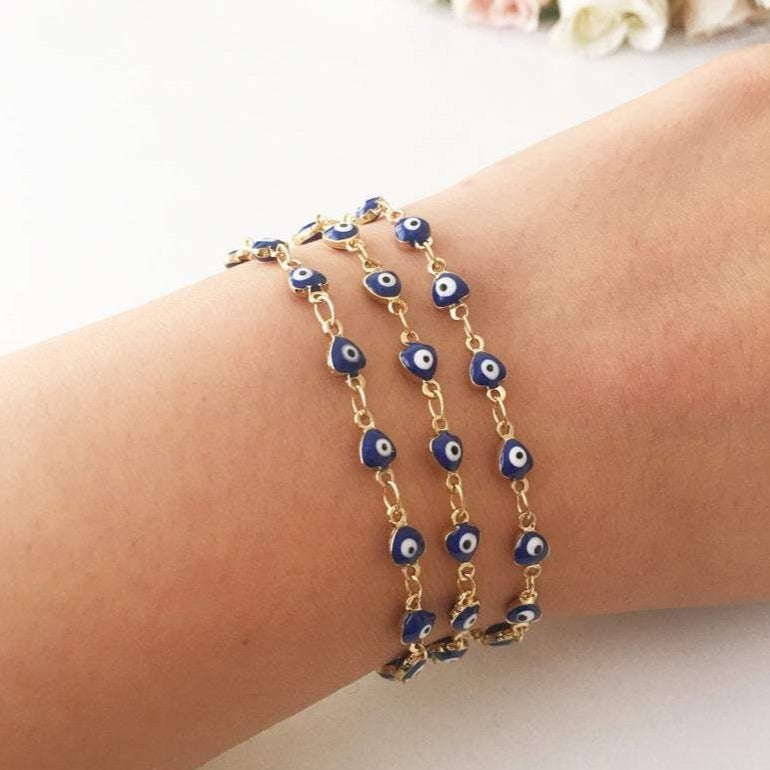 A stylish Blue Evil Eye Bracelet featuring 4mm blue evil eye beads on a minimalist gold chain, perfect for protection and fashion.