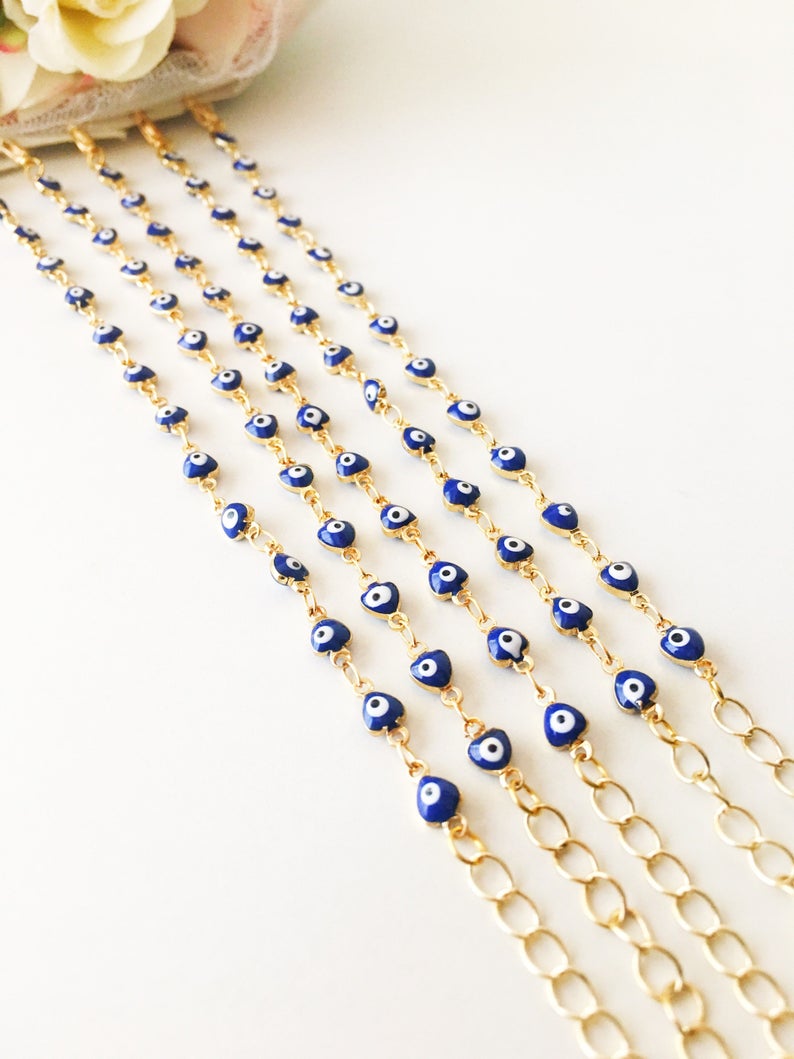 A stylish Blue Evil Eye Bracelet featuring 4mm blue evil eye beads on a minimalist gold chain, perfect for protection and fashion.