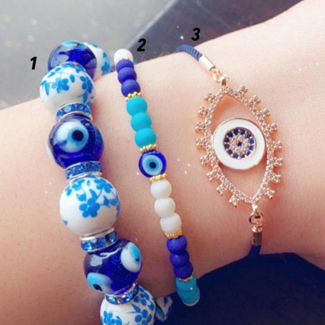 Handmade Blue Evil Eye Bracelet featuring ceramic and glass beads, adjustable design for comfort, symbolizing luck and protection.