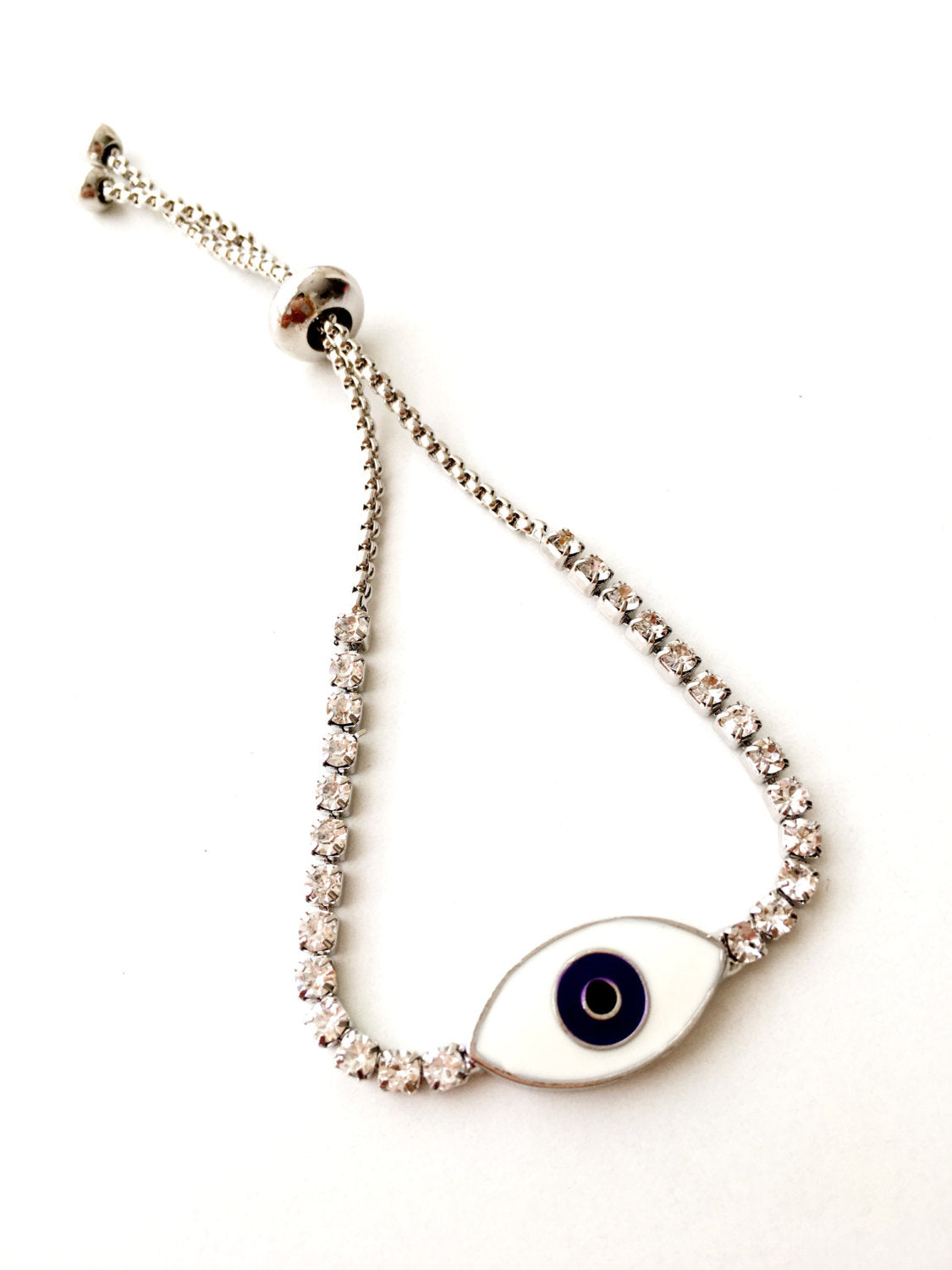 A beautiful Blue Evil Eye Bracelet made of stainless steel and zirconia, featuring an adjustable design for a perfect fit.