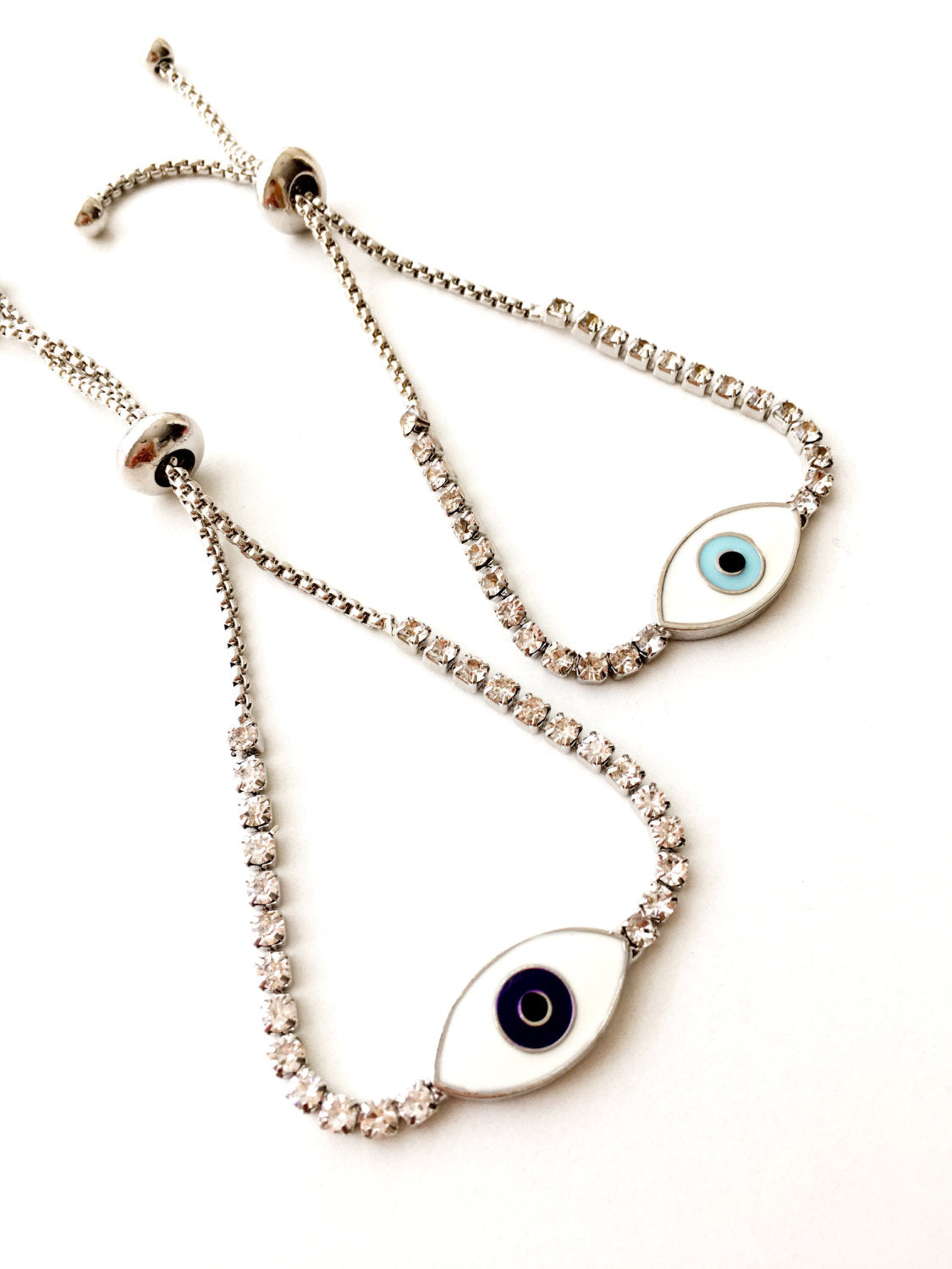 A beautiful Blue Evil Eye Bracelet made of stainless steel and zirconia, featuring an adjustable design for a perfect fit.