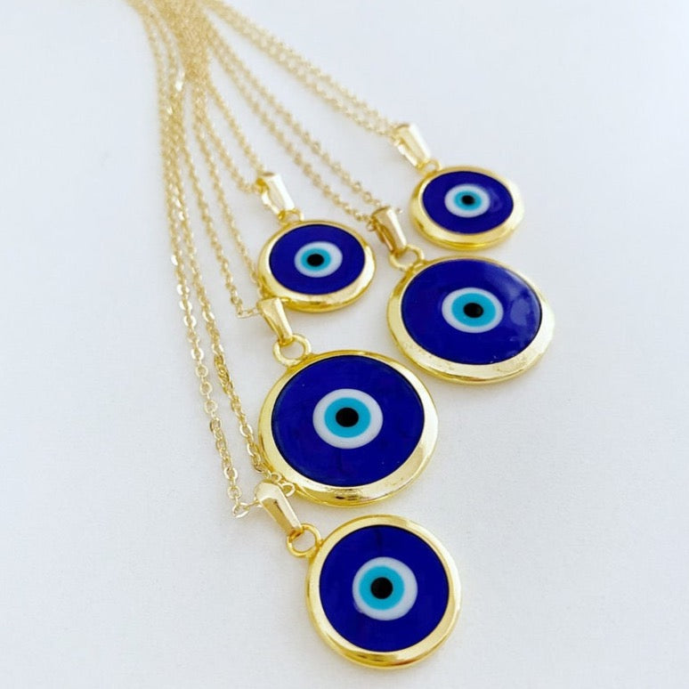 A beautiful Blue Evil Eye Necklace featuring a dark blue Murano glass bead on a gold stainless steel chain, symbolizing protection.