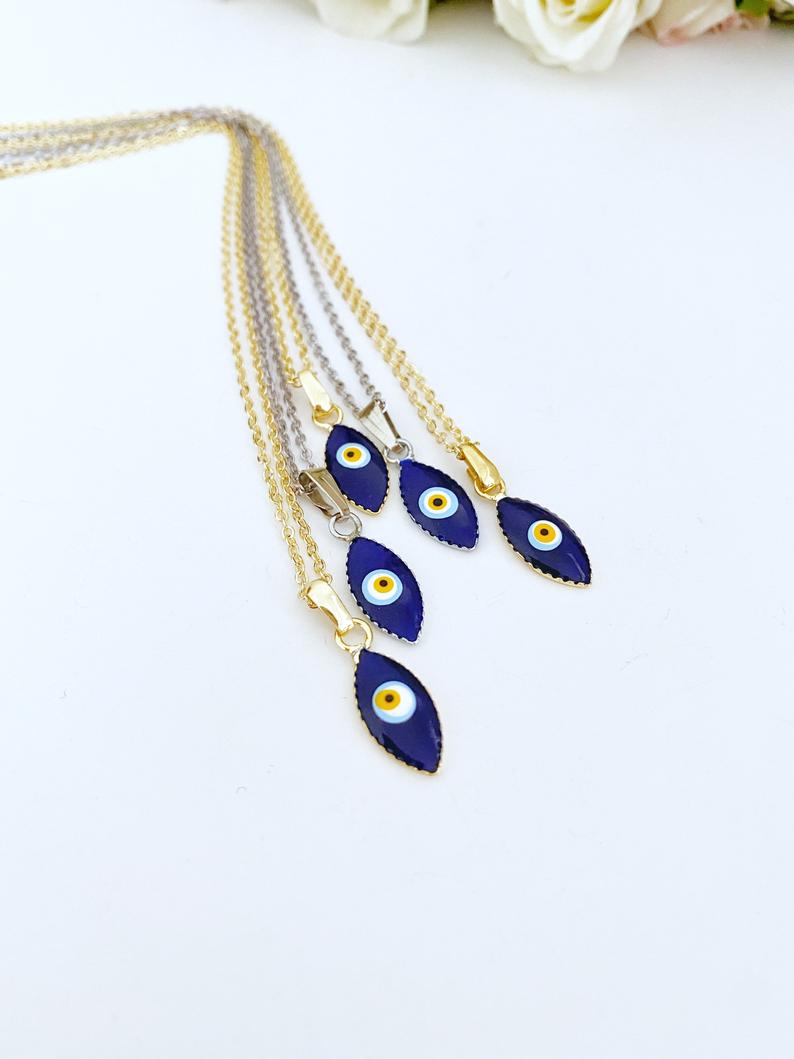 Handmade blue evil eye teardrop necklace with gold chain, symbolizing protection and luck.