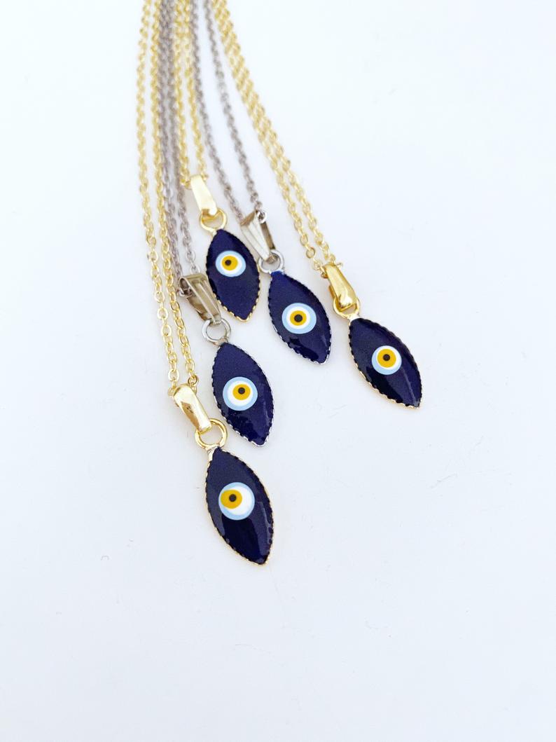 Handmade blue evil eye teardrop necklace with gold chain, symbolizing protection and luck.