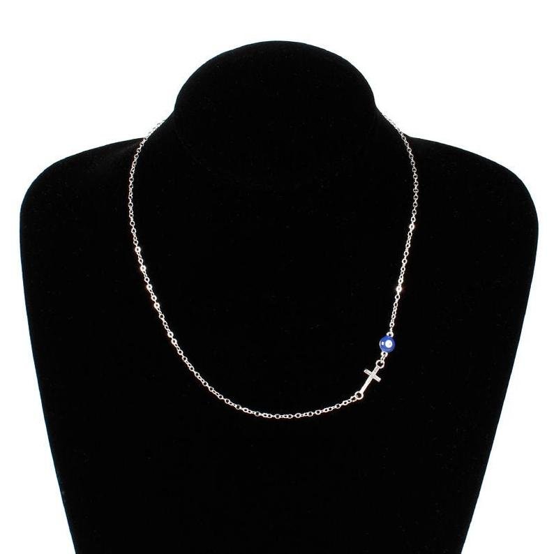 Blue Evil Eye Sideways Cross Necklace featuring a minimalist choker design with an evil eye bead and cross charm in gold and silver options.