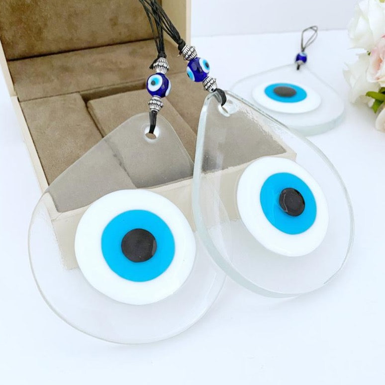 A beautiful handmade Blue Evil Eye Wall Hanging featuring a fused glass bead, symbolizing protection and good fortune.