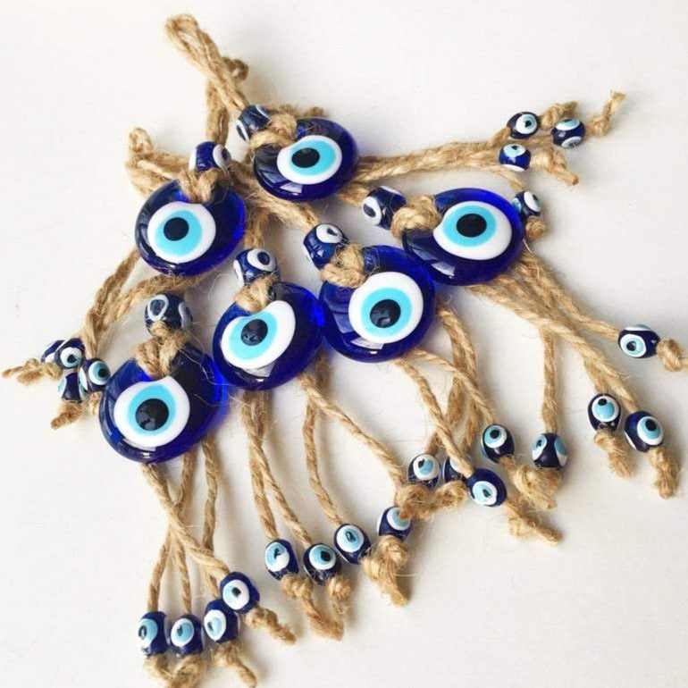 Small blue evil eye wall hanging with gold macrame, featuring a 3.5cm diameter evil eye bead, perfect for home decor and gifts.