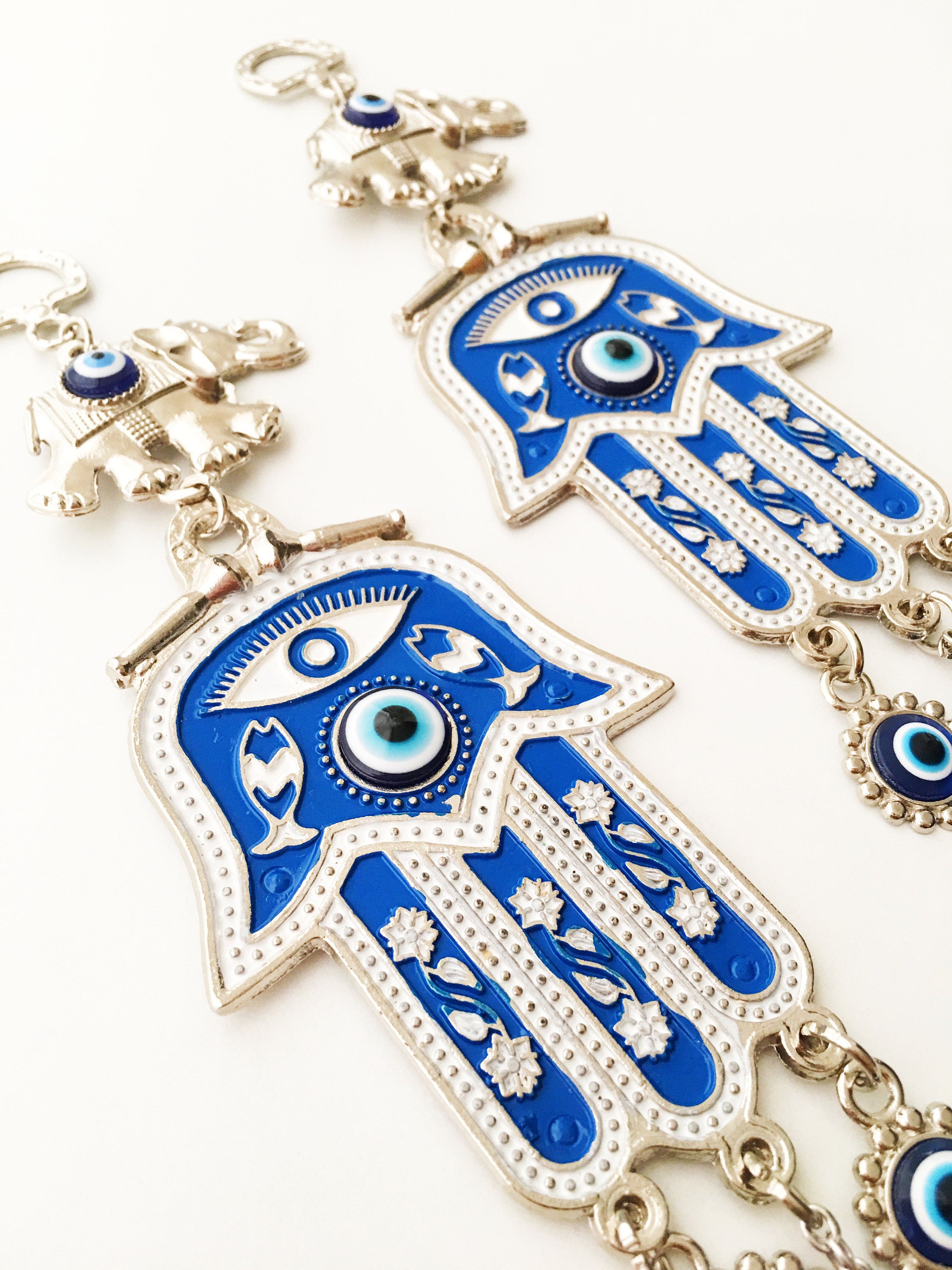 Blue Hamsa Evil Eye Wall Art featuring a mosaic metal hamsa hand and large evil eye bead, symbolizing protection and good luck.