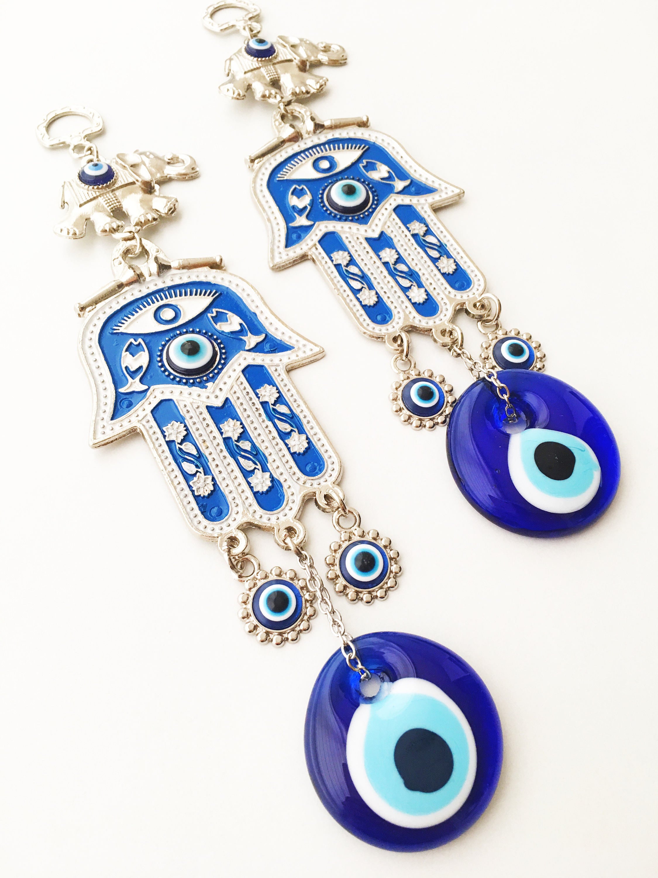 Blue Hamsa Evil Eye Wall Art featuring a mosaic metal hamsa hand and large evil eye bead, symbolizing protection and good luck.