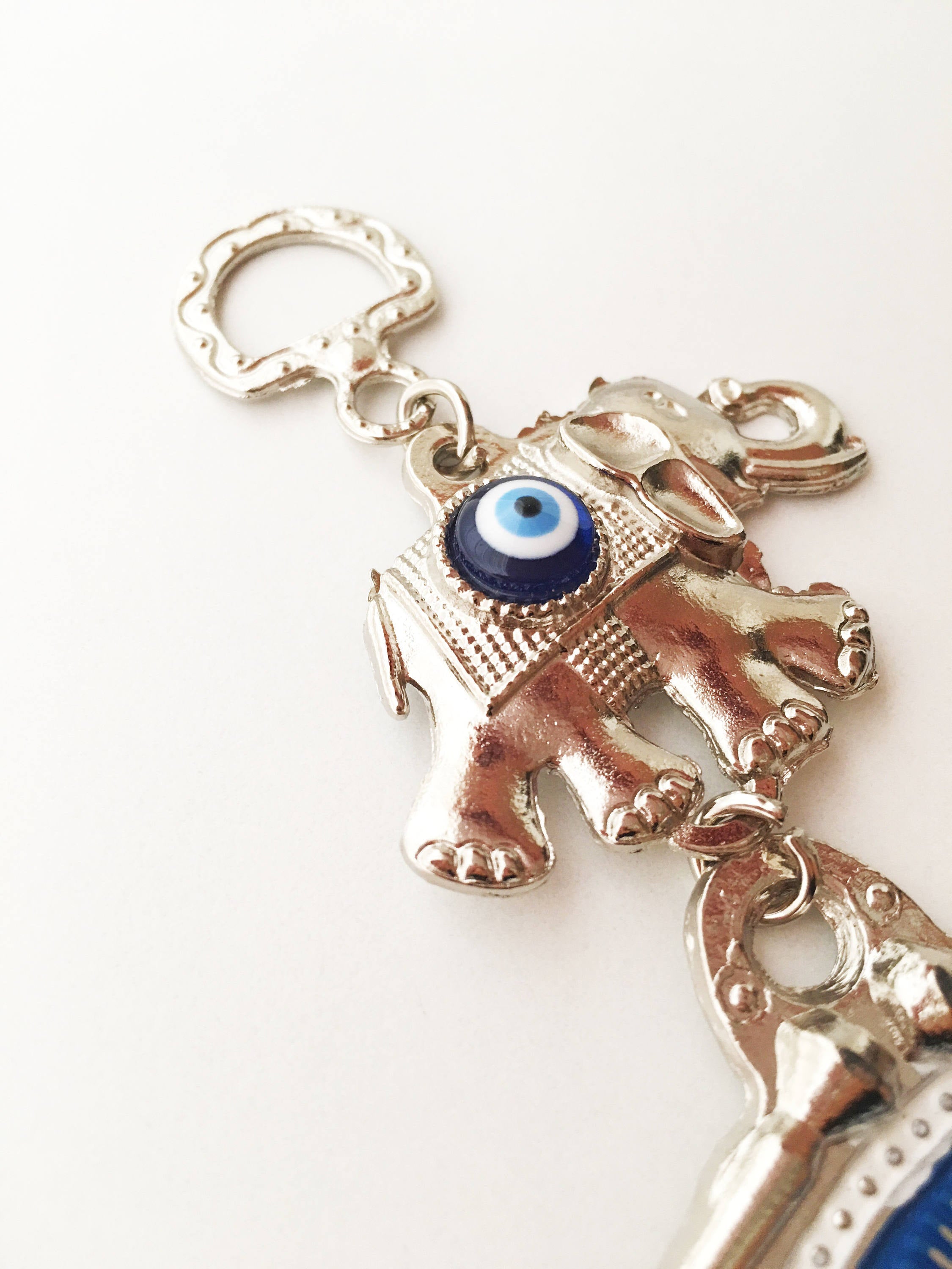 Blue Hamsa Evil Eye Wall Art featuring a mosaic metal hamsa hand and large evil eye bead, symbolizing protection and good luck.