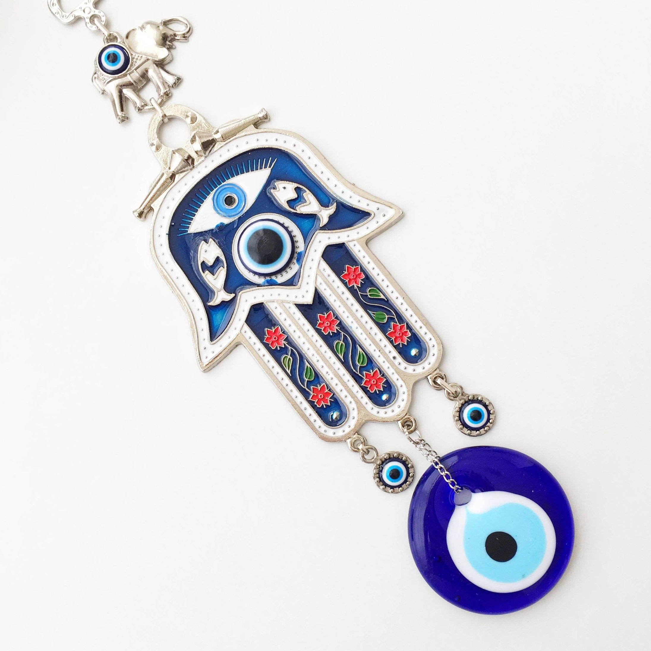 Blue Hamsa Hand Wall Decor featuring a large evil eye bead, intricately designed with mosaic metal.