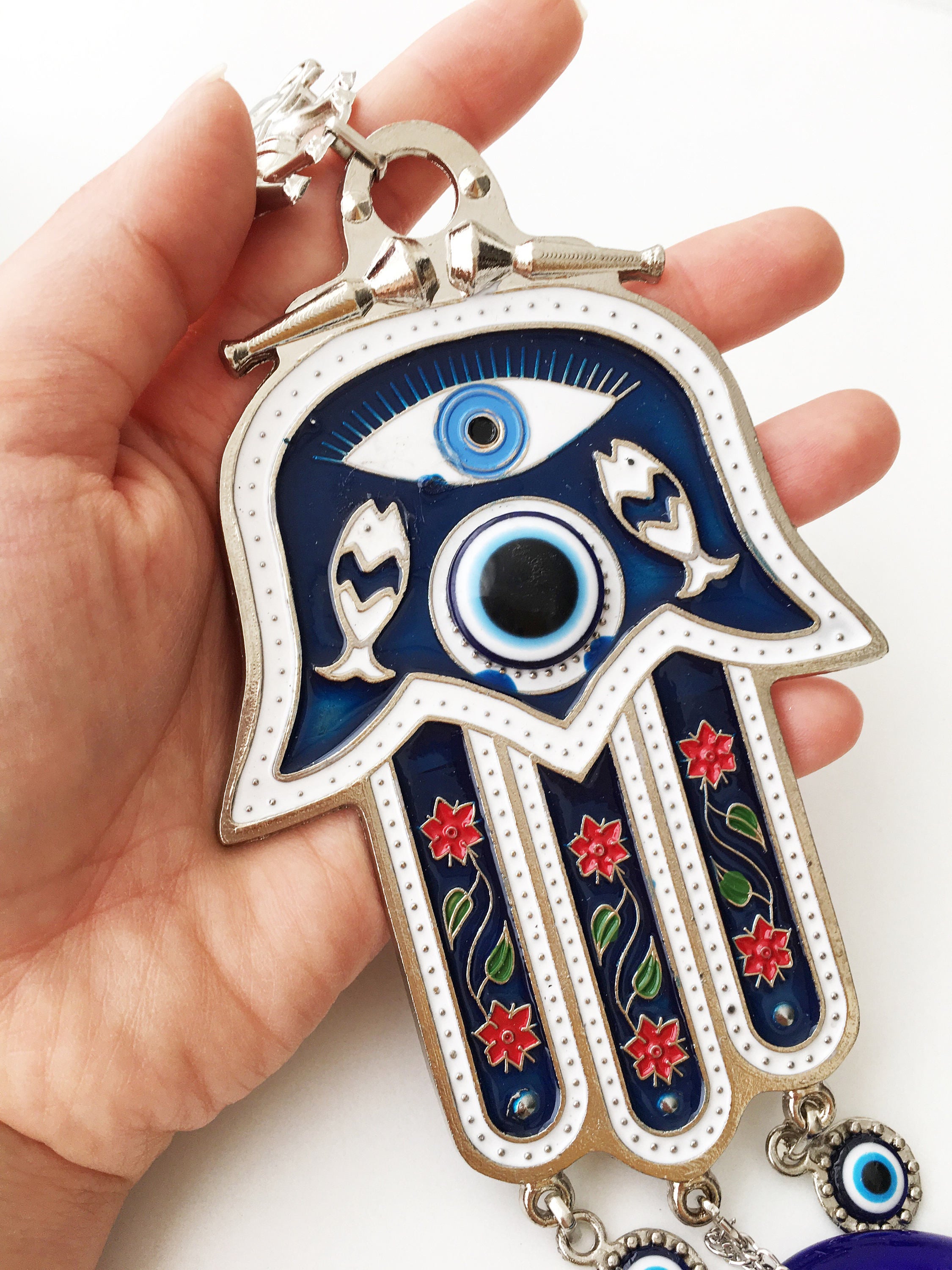 Blue Hamsa Hand Wall Decor featuring a large evil eye bead, intricately designed with mosaic metal.