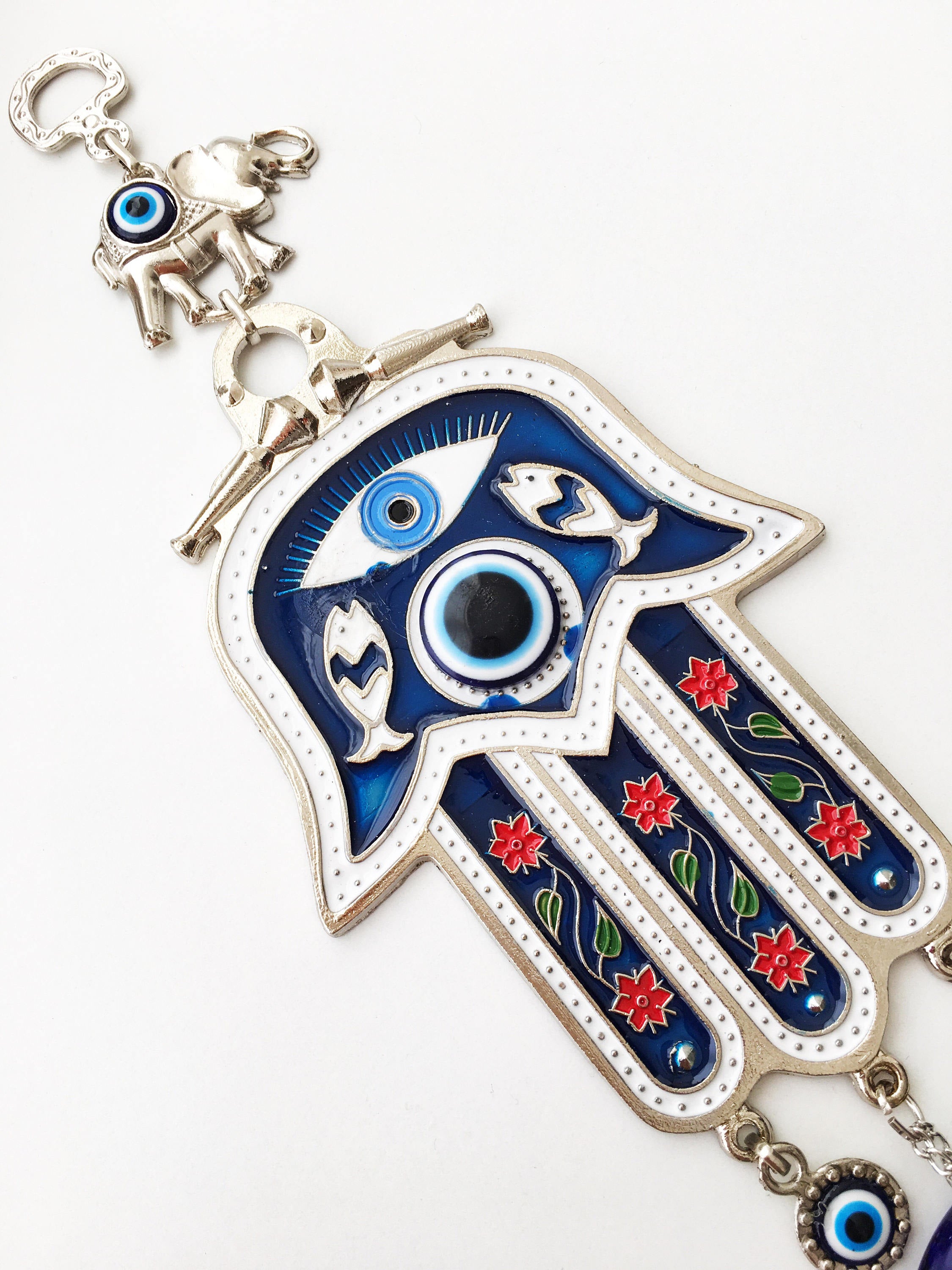 Blue Hamsa Hand Wall Decor featuring a large evil eye bead, intricately designed with mosaic metal.