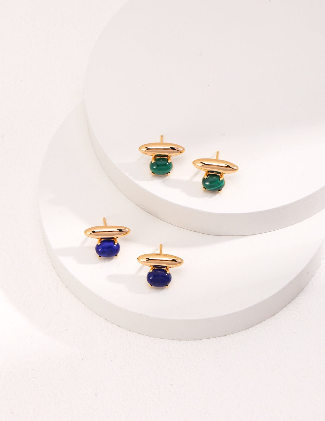 A pair of elegant Blue Lapis Lazuli Stud Earrings featuring natural pearl and gold vermeil, showcasing their unique craftsmanship and rich color.