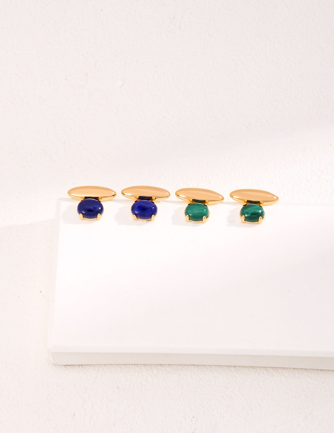 A pair of elegant Blue Lapis Lazuli Stud Earrings featuring natural pearl and gold vermeil, showcasing their unique craftsmanship and rich color.