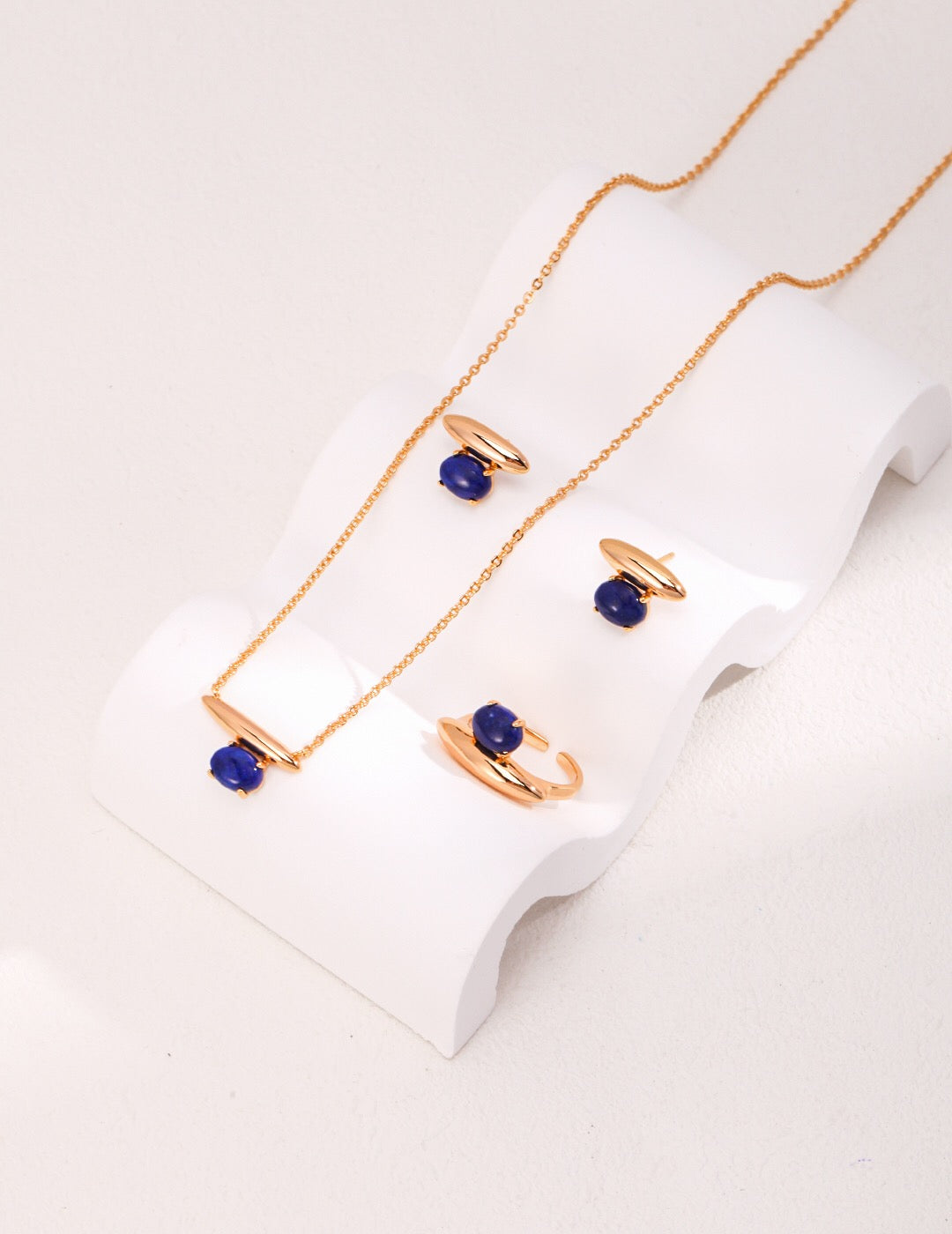 A pair of elegant Blue Lapis Lazuli Stud Earrings featuring natural pearl and gold vermeil, showcasing their unique craftsmanship and rich color.