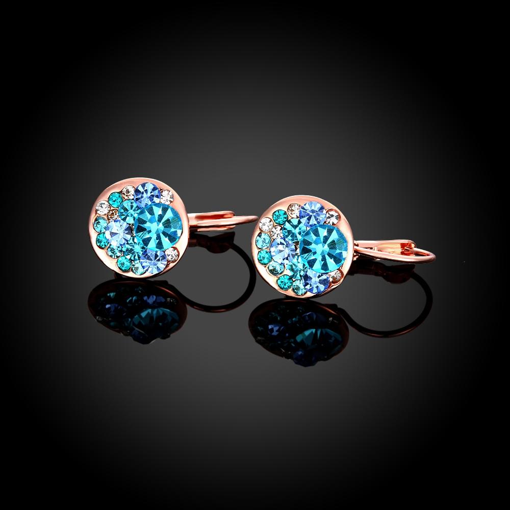 Elegant Blue Periwinkle Leverback Earrings crafted in 14K Rose Gold, featuring certified crystals and a lightweight design.