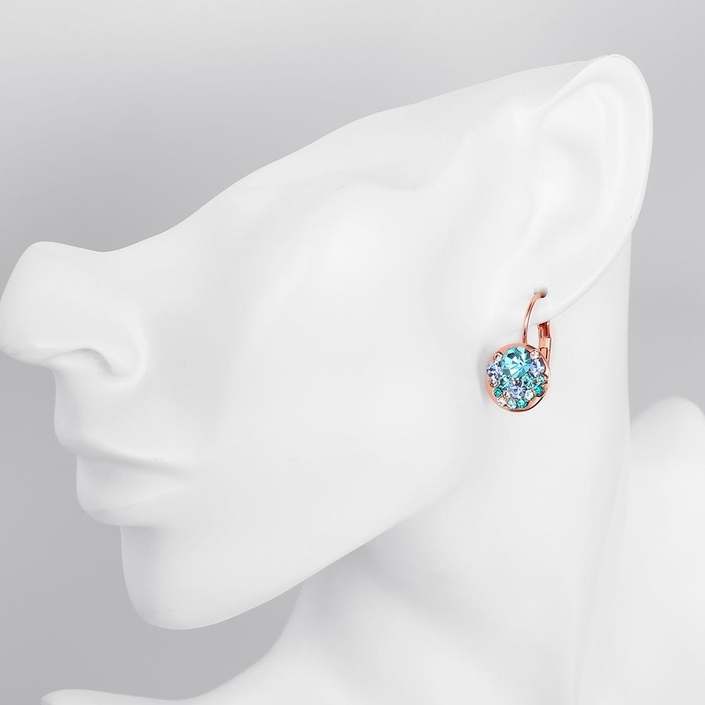 Elegant Blue Periwinkle Leverback Earrings crafted in 14K Rose Gold, featuring certified crystals and a lightweight design.