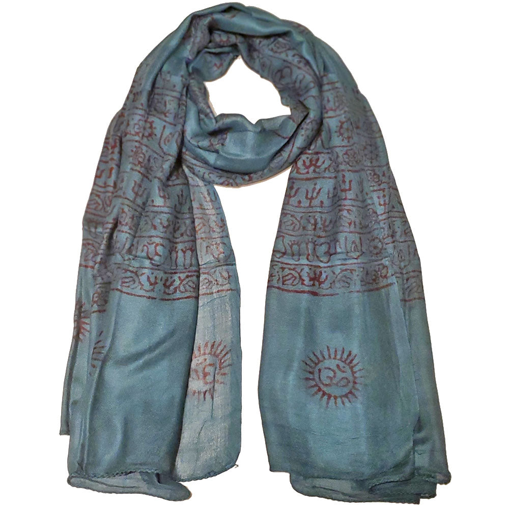 A vibrant blue scarf featuring intricate Om and Asian symbols in red-orange, made from 100% cotton, perfect for meditation and traditional wear.