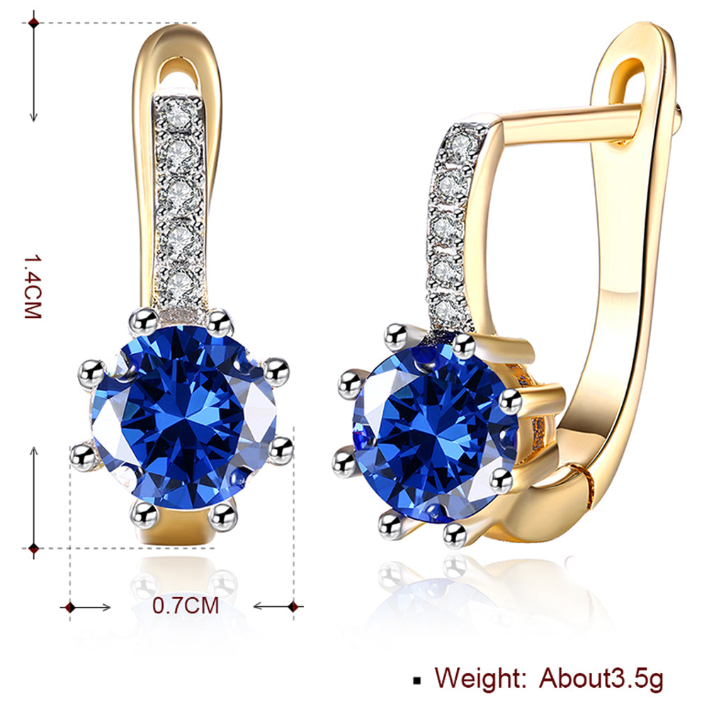 Elegant Blue Topaz 0.70 CT Round Huggie Earring in 18K White Gold Plated, showcasing a vibrant blue gemstone and luxurious finish.