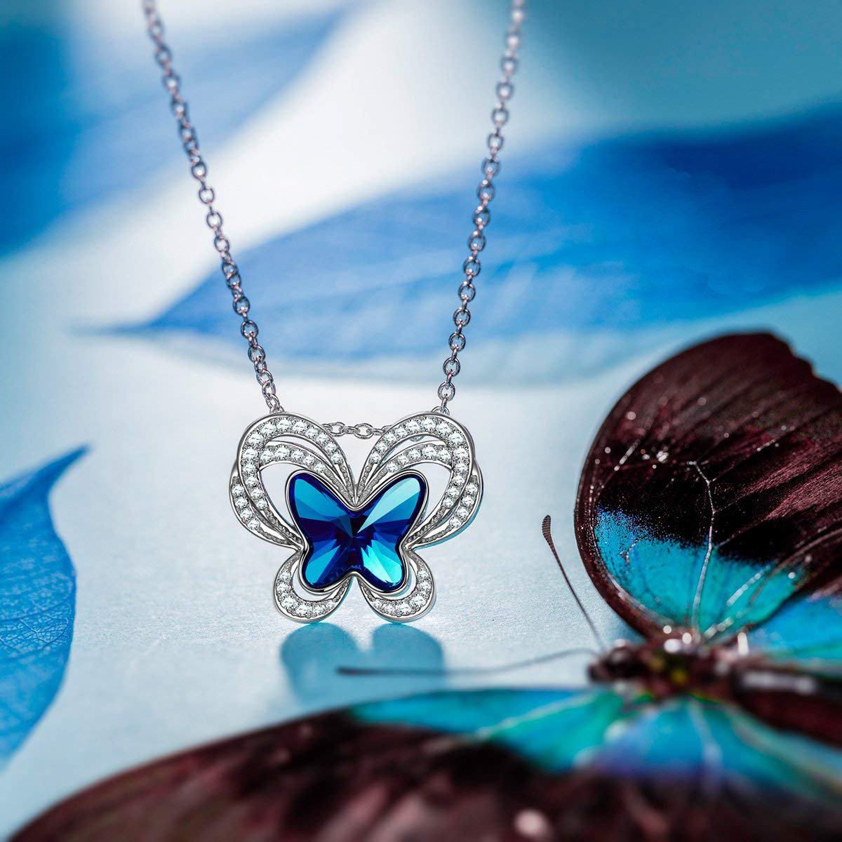 Elegant Blue Topaz Butterfly Necklace designed in Italy, featuring 18K white gold plating and embellished with sparkling Austrian crystals.