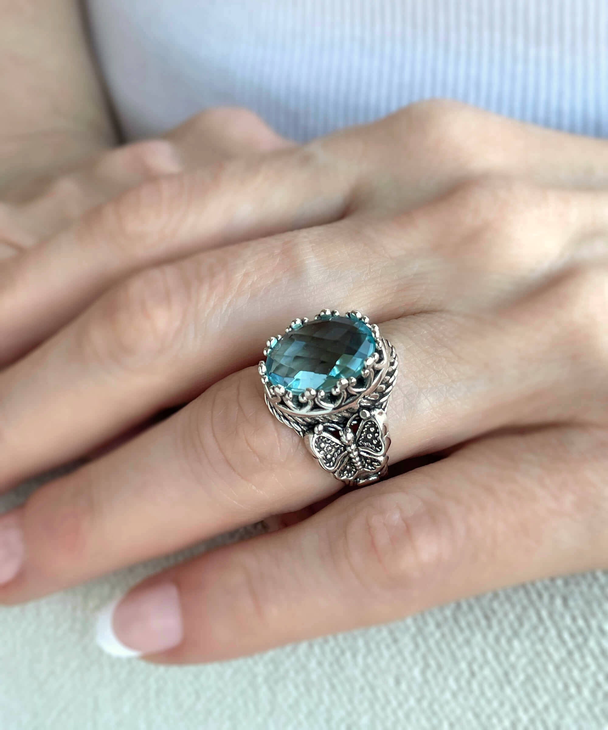 Elegant Blue Topaz Gemstone Filigree Art Double Butterfly Ring in 925 sterling silver, showcasing intricate detailing and a stunning sky blue topaz.