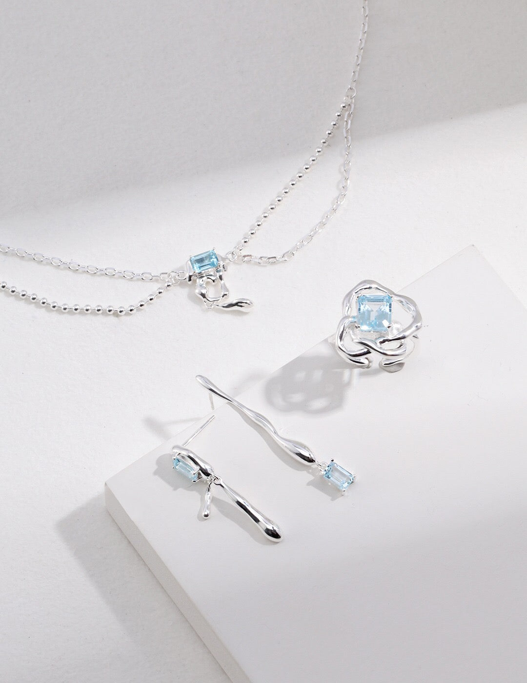 A stunning Blue Topaz Statement Necklace featuring a vibrant blue topaz pendant set in tarnish-resistant sterling silver, elegantly displayed.