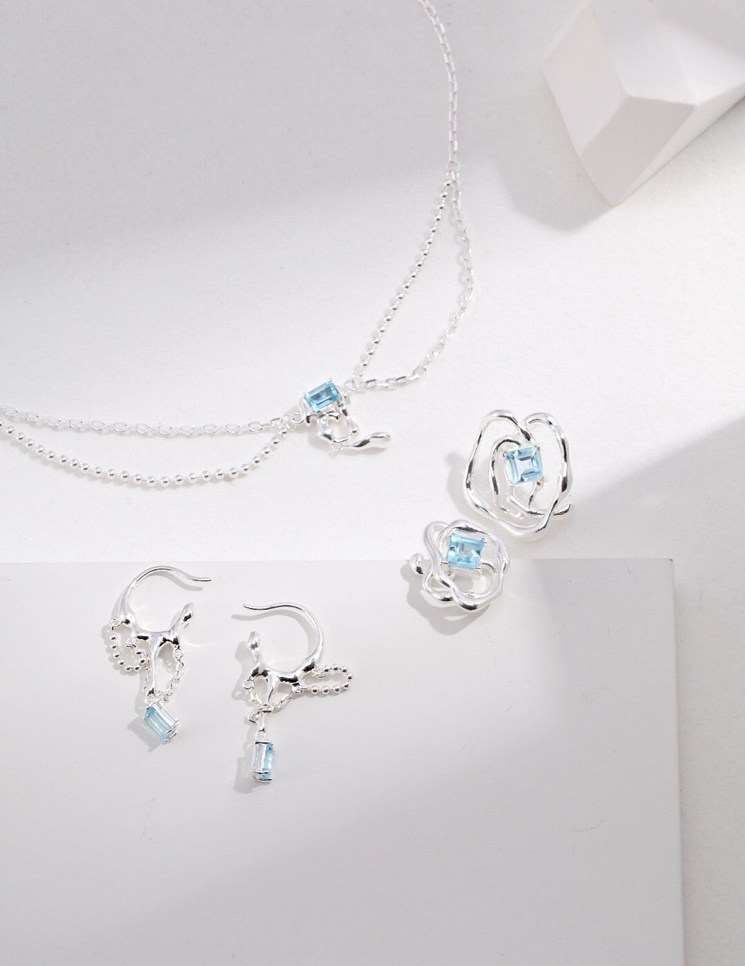 A stunning Blue Topaz Statement Necklace featuring a vibrant blue topaz pendant set in tarnish-resistant sterling silver, elegantly displayed.