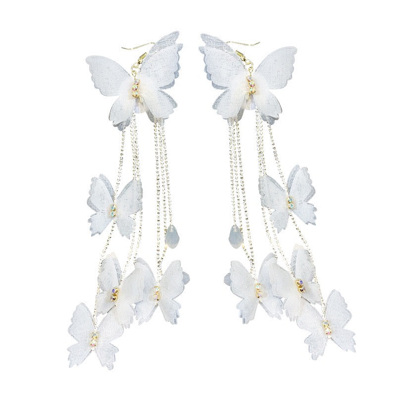 Elegant Bohemia Lace Butterfly Earrings with Triple Pearl Tassels, showcasing intricate lace design and sparkling rhinestones.