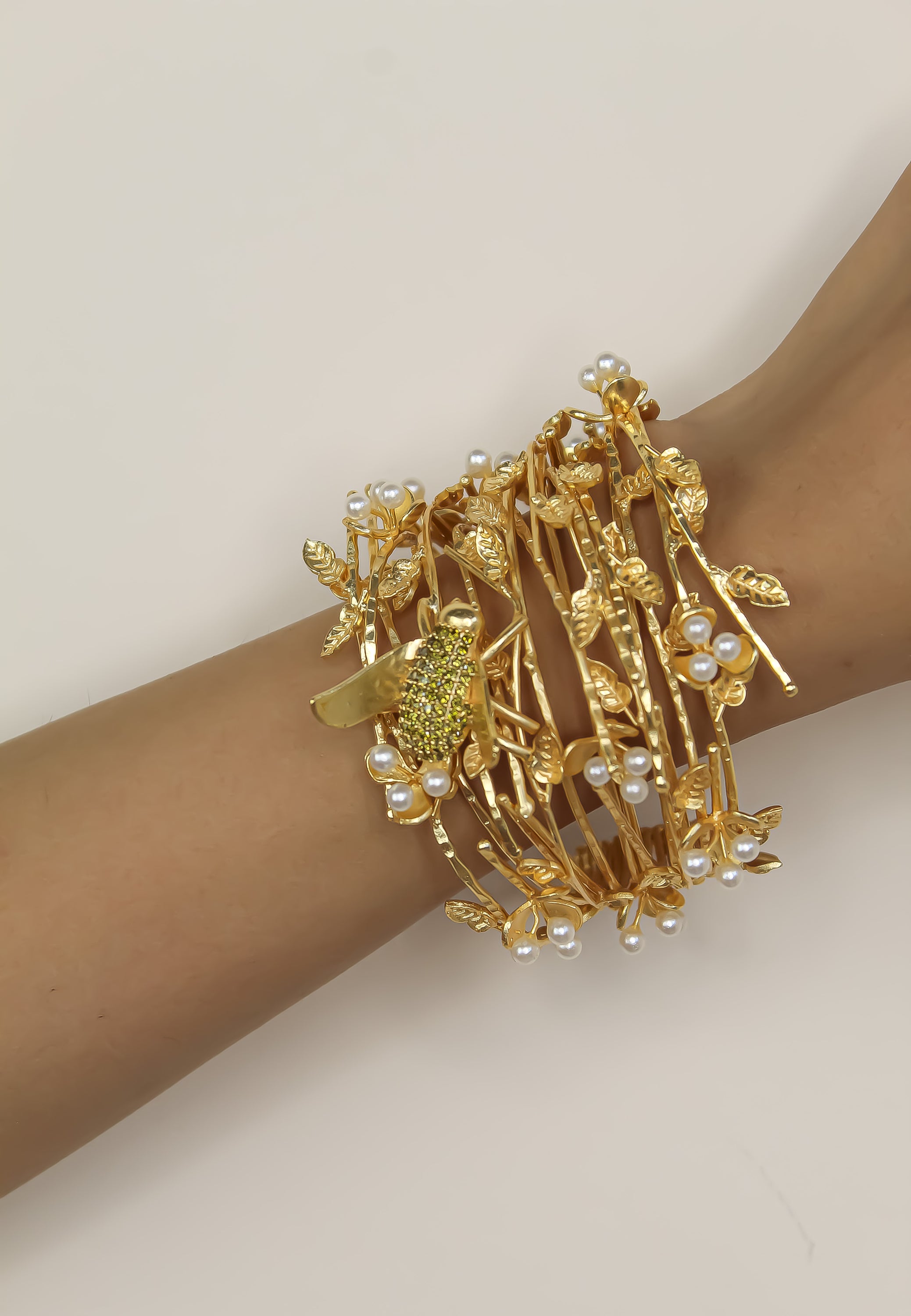 A beautifully crafted Botanical Bracelet featuring intricate floral designs, 18K gold plating, and an adjustable size for comfort.