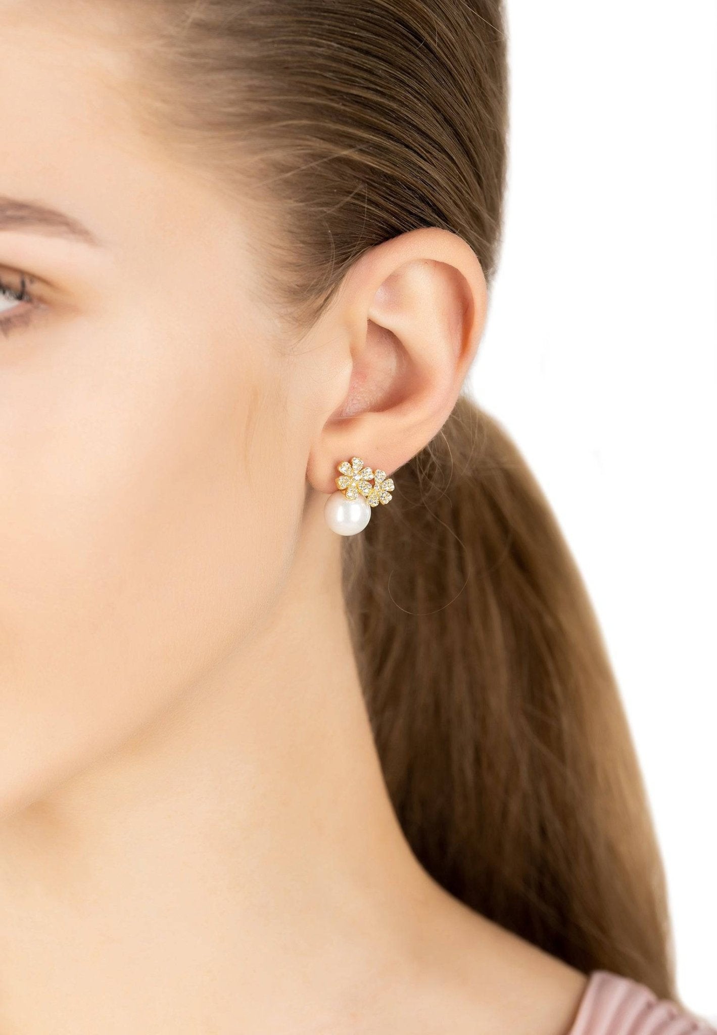 Elegant gold bouquet and pearl stud earrings featuring cubic zirconia, perfect for bridal and evening wear.