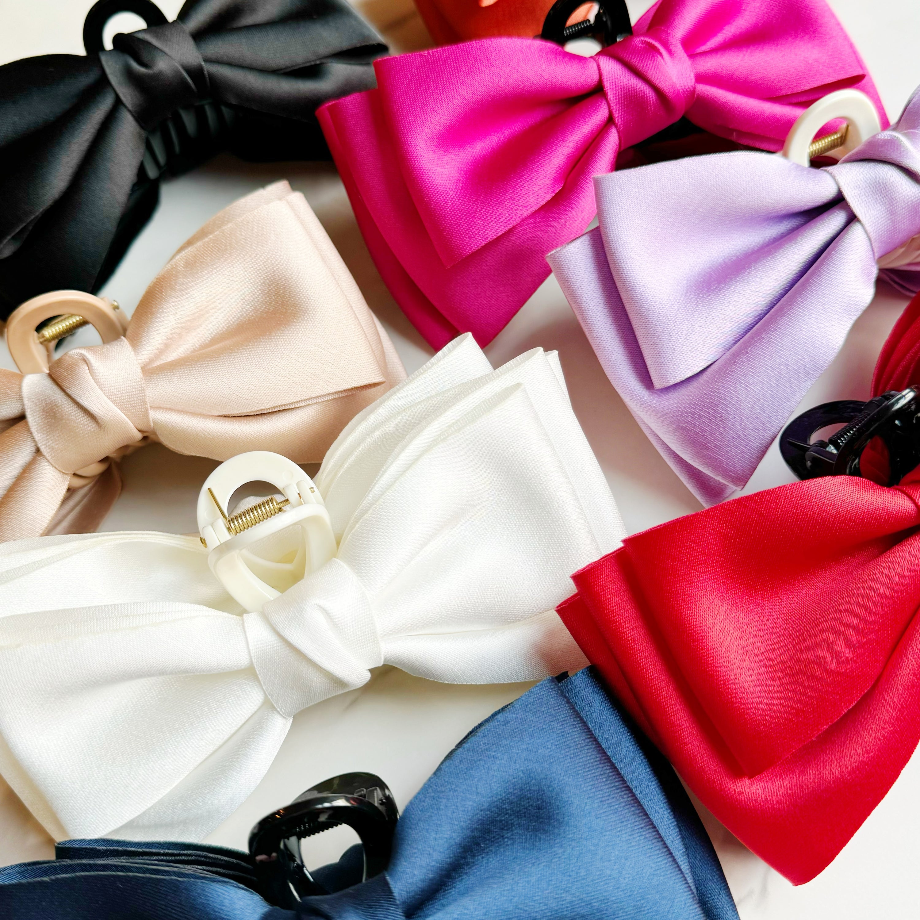 Bow Beauty Hair Claw featuring a stylish bow design, available in multiple colors, perfect for game days.