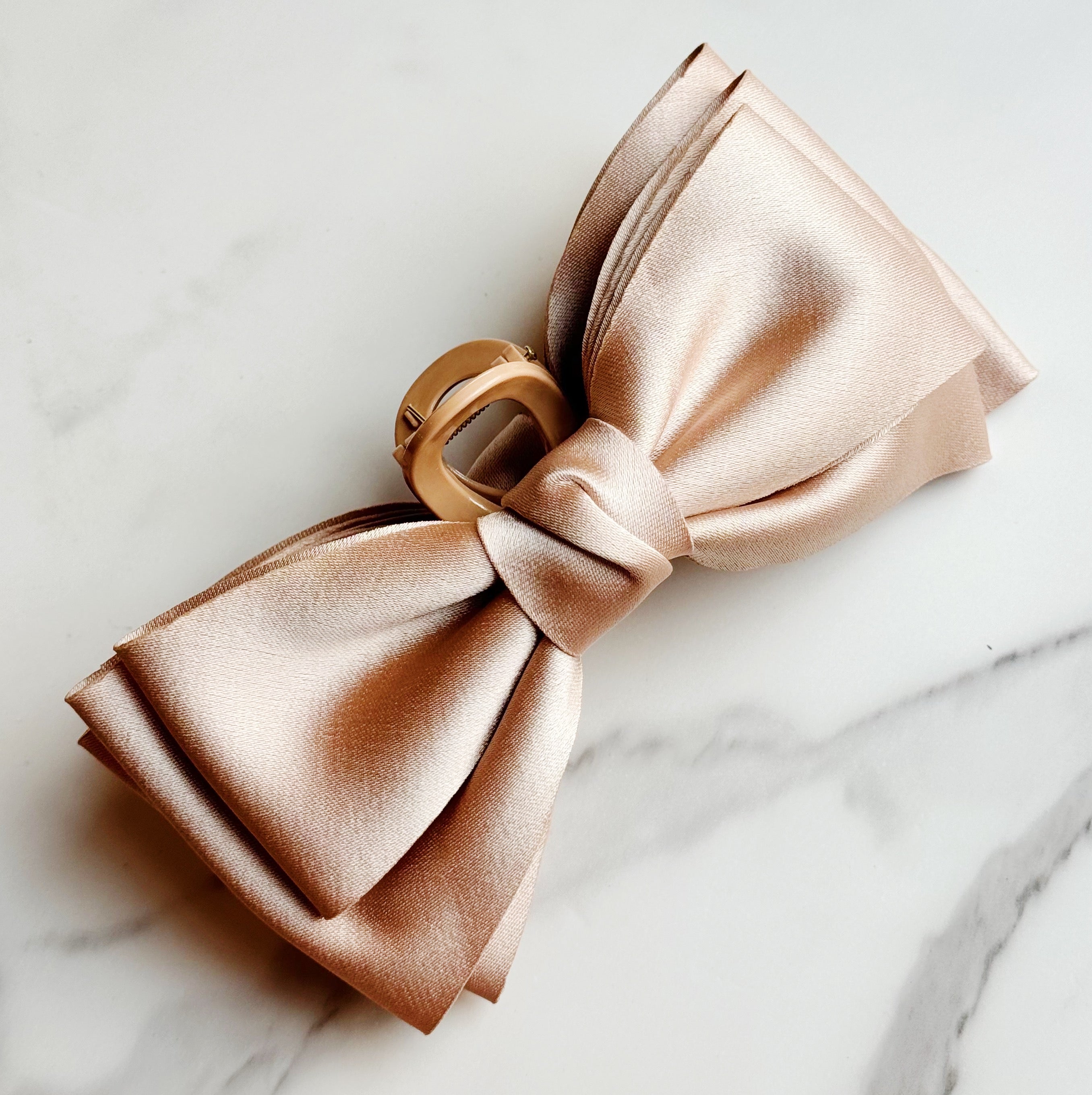 Bow Beauty Hair Claw featuring a stylish bow design, available in multiple colors, perfect for game days.