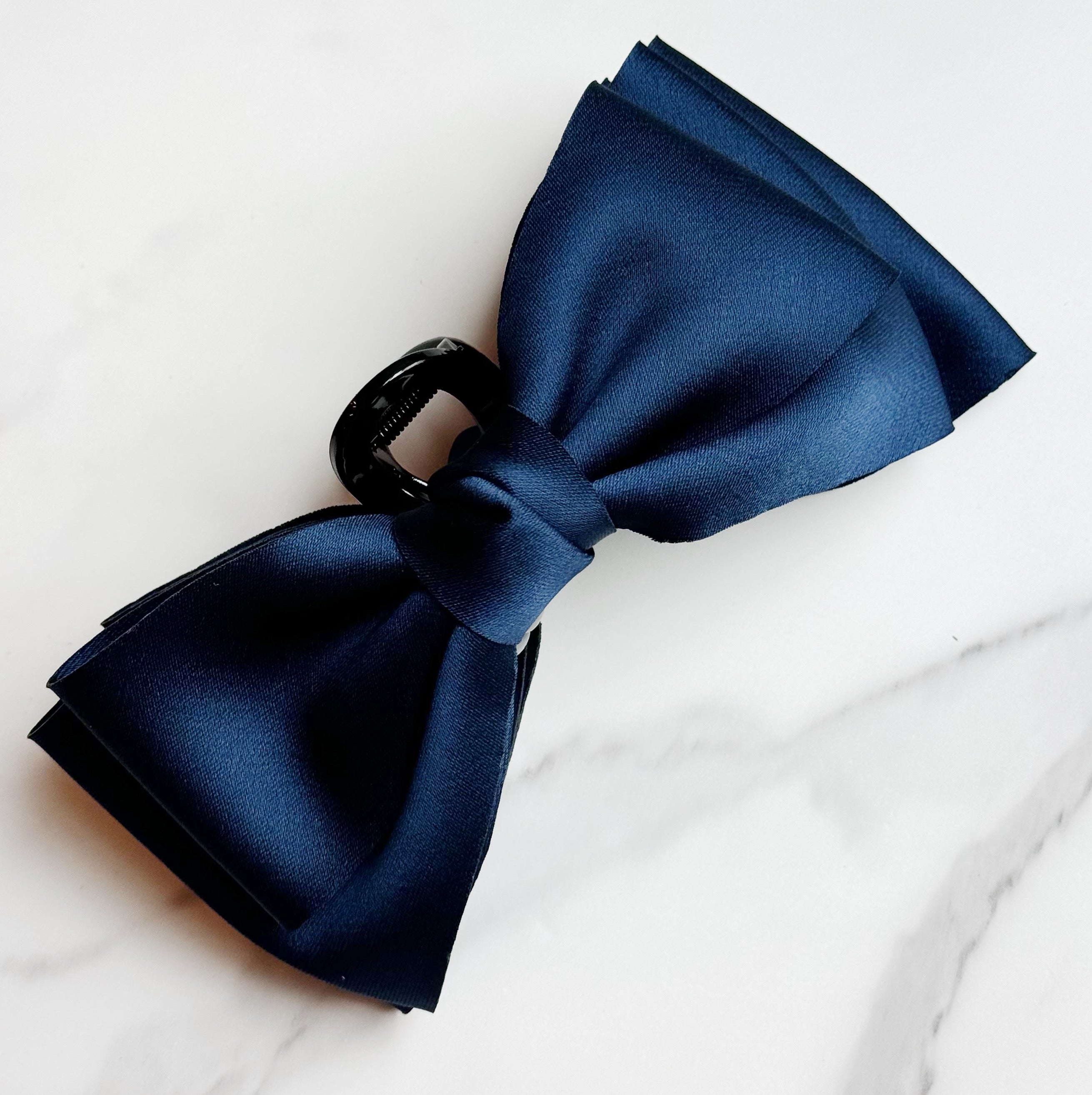 Bow Beauty Hair Claw featuring a stylish bow design, available in multiple colors, perfect for game days.