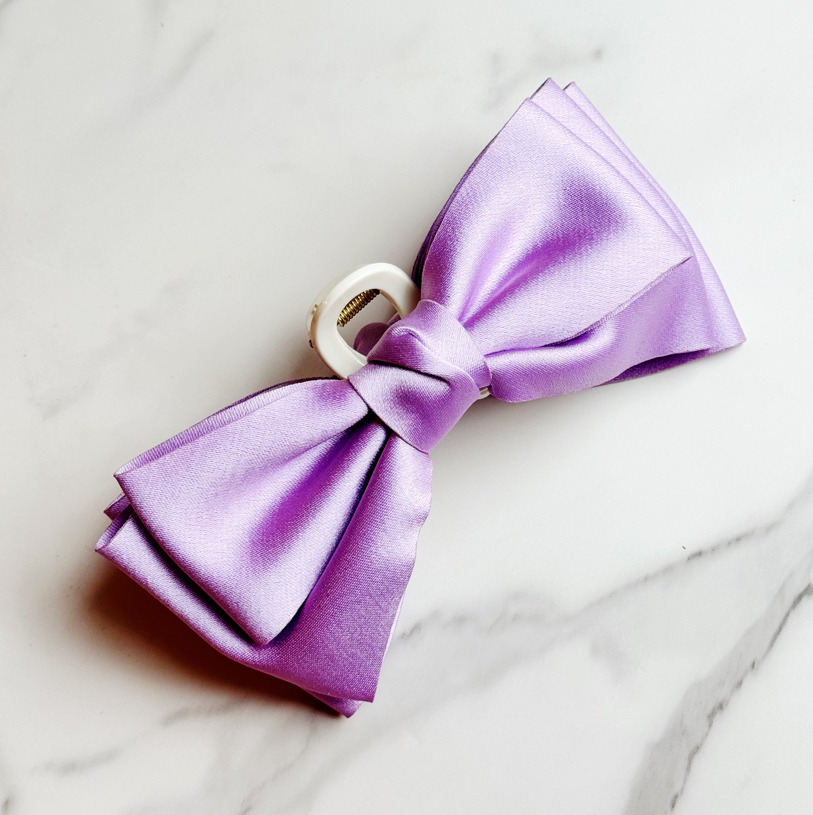 Bow Beauty Hair Claw featuring a stylish bow design, available in multiple colors, perfect for game days.