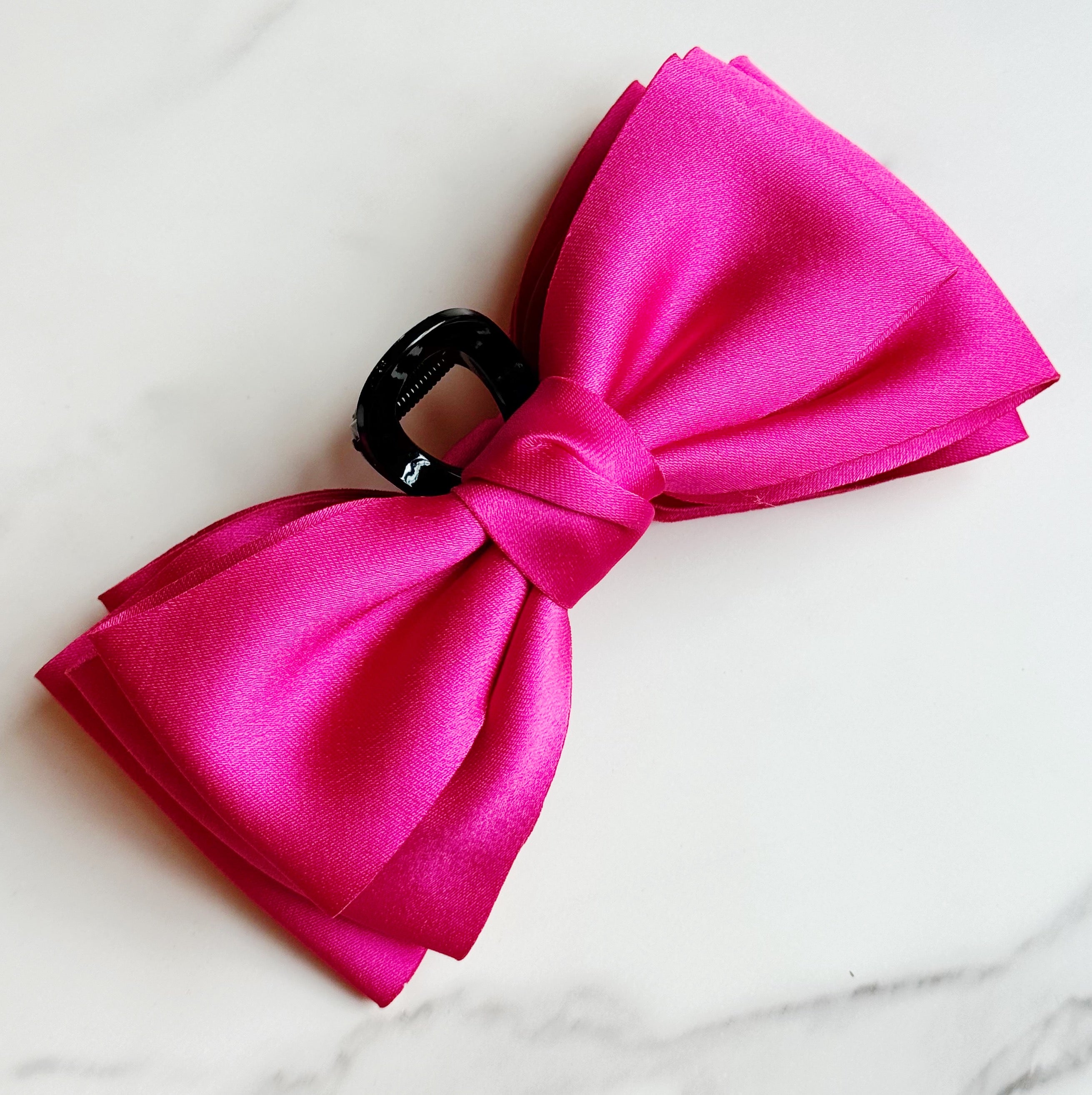 Bow Beauty Hair Claw featuring a stylish bow design, available in multiple colors, perfect for game days.