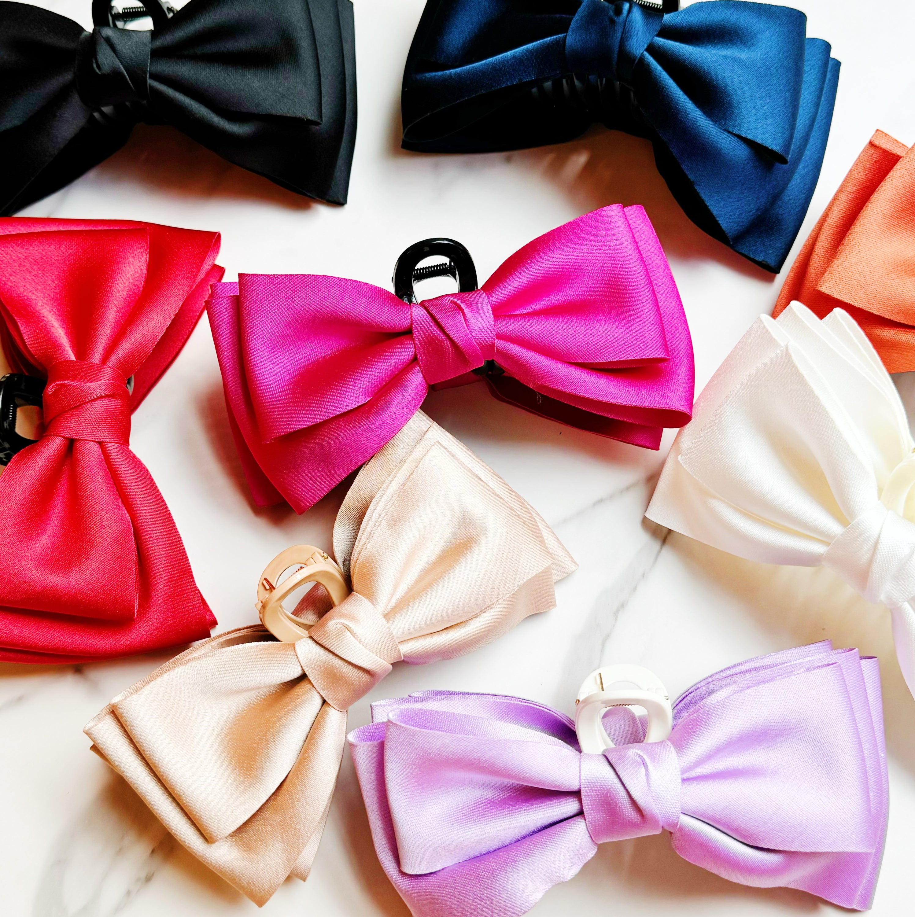 Bow Beauty Hair Claw featuring a stylish bow design, available in multiple colors, perfect for game days.