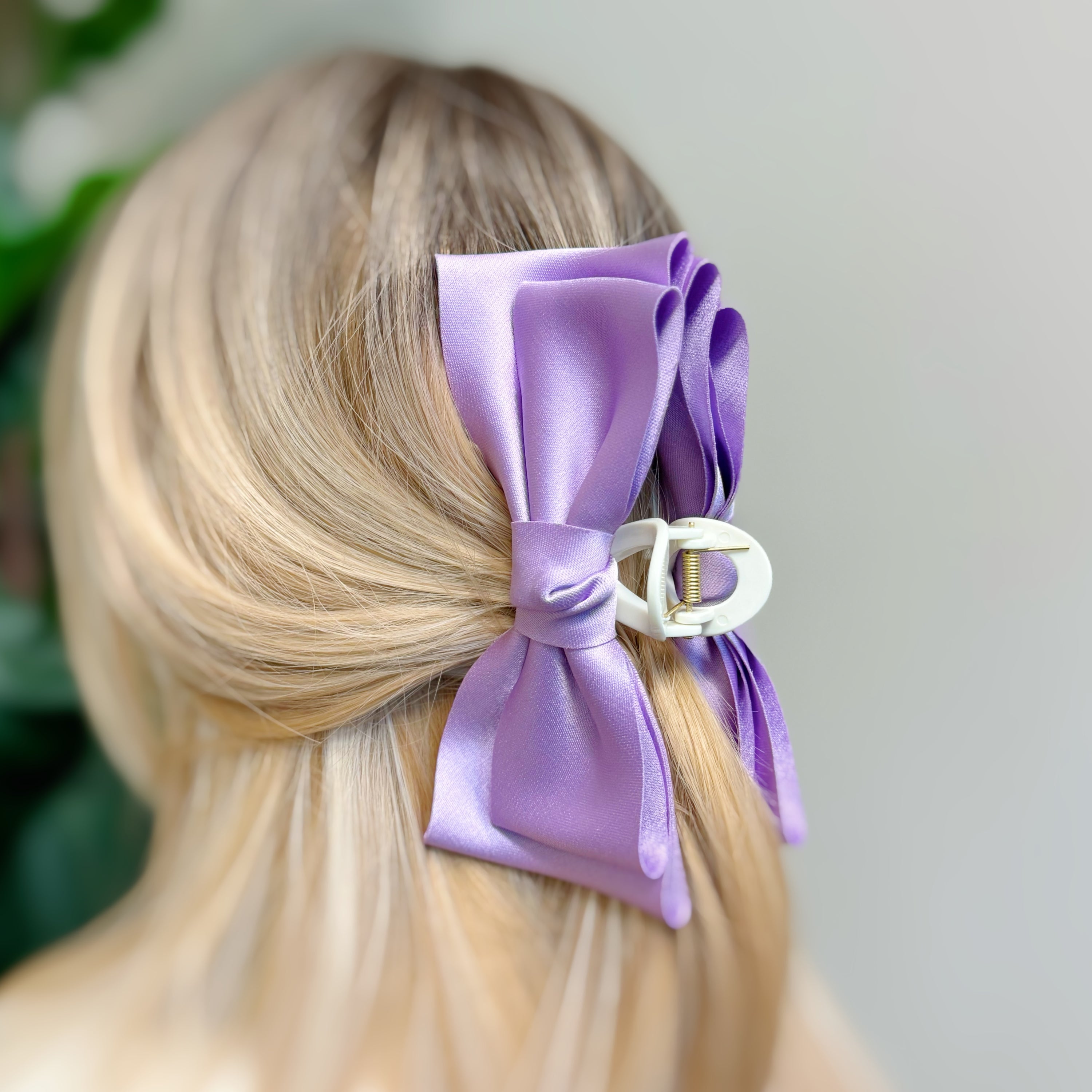 Bow Beauty Hair Claw featuring a stylish bow design, available in multiple colors, perfect for game days.