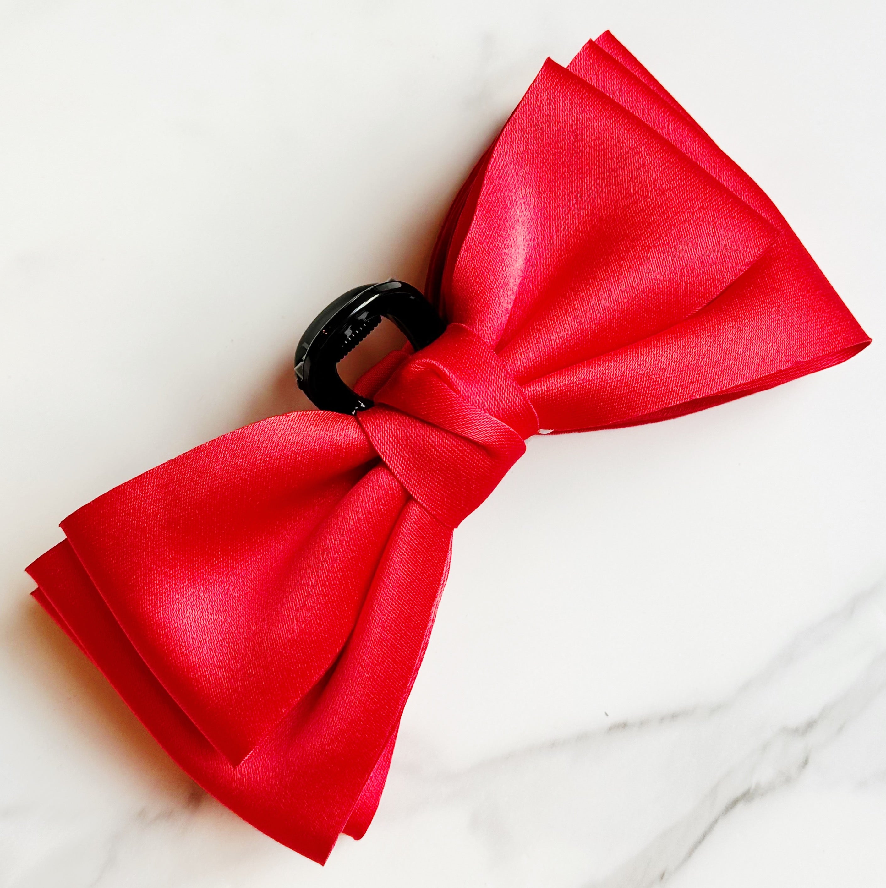 Bow Beauty Hair Claw featuring a stylish bow design, available in multiple colors, perfect for game days.