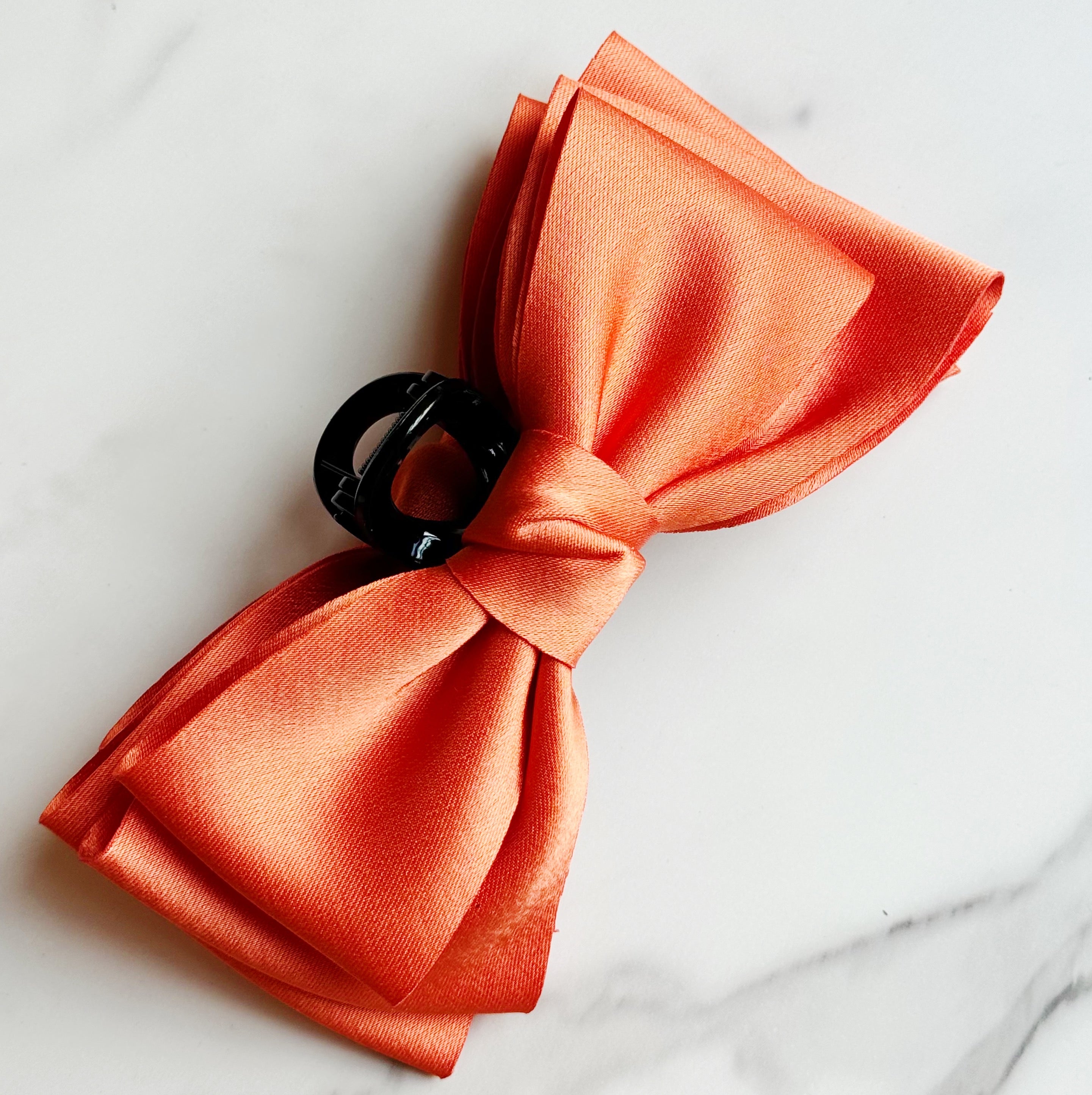 Bow Beauty Hair Claw featuring a stylish bow design, available in multiple colors, perfect for game days.