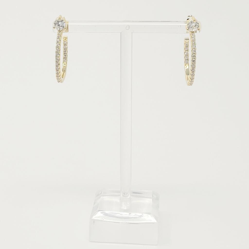 Elegant Bow On Top Hoop Earrings with shiny cubic zirconia, 18K gold plated brass, showcasing a chic design.