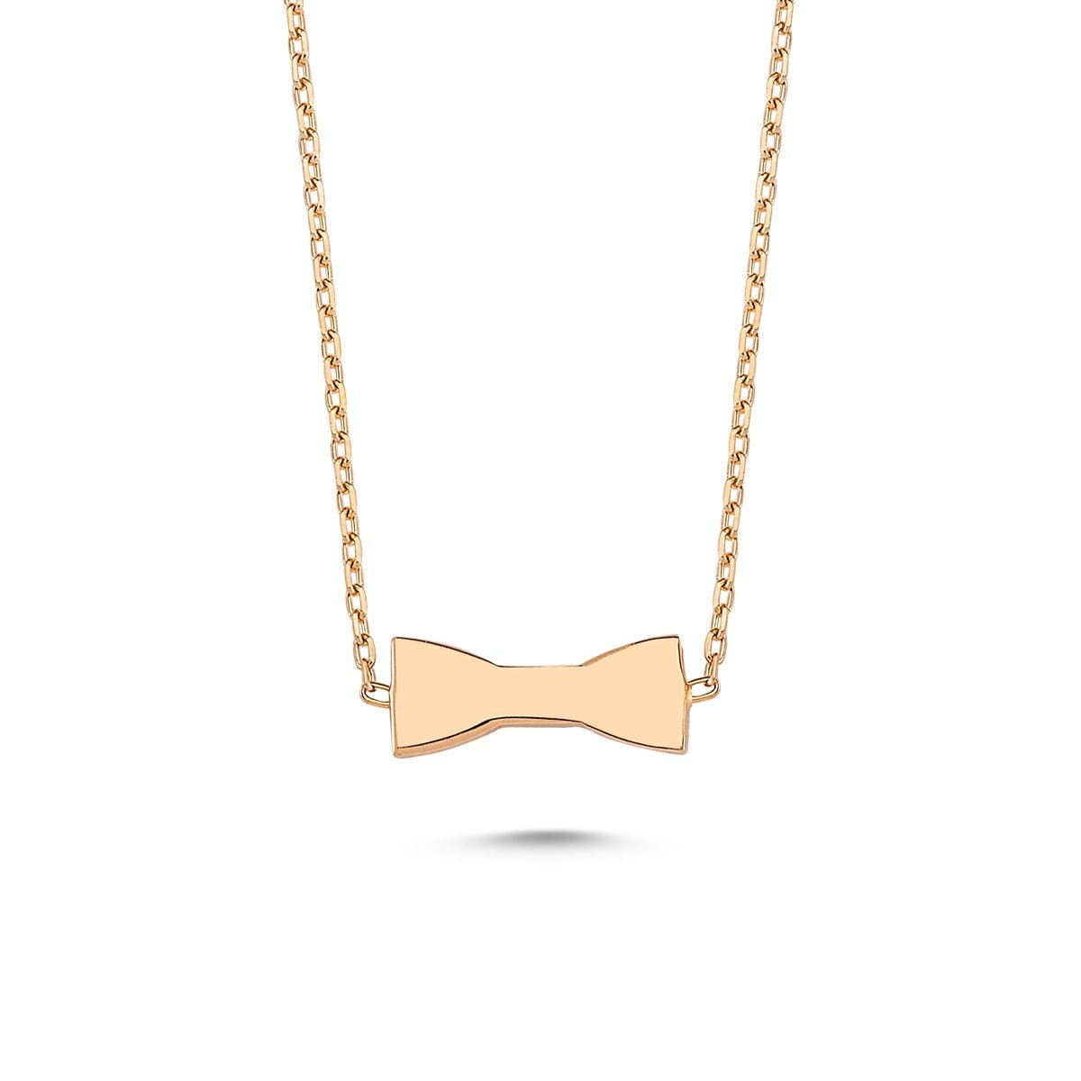 A delicate Bow Tie Dainty Silver Chain Necklace featuring a handmade 925 sterling silver pendant with an 18k rose gold plated finish.