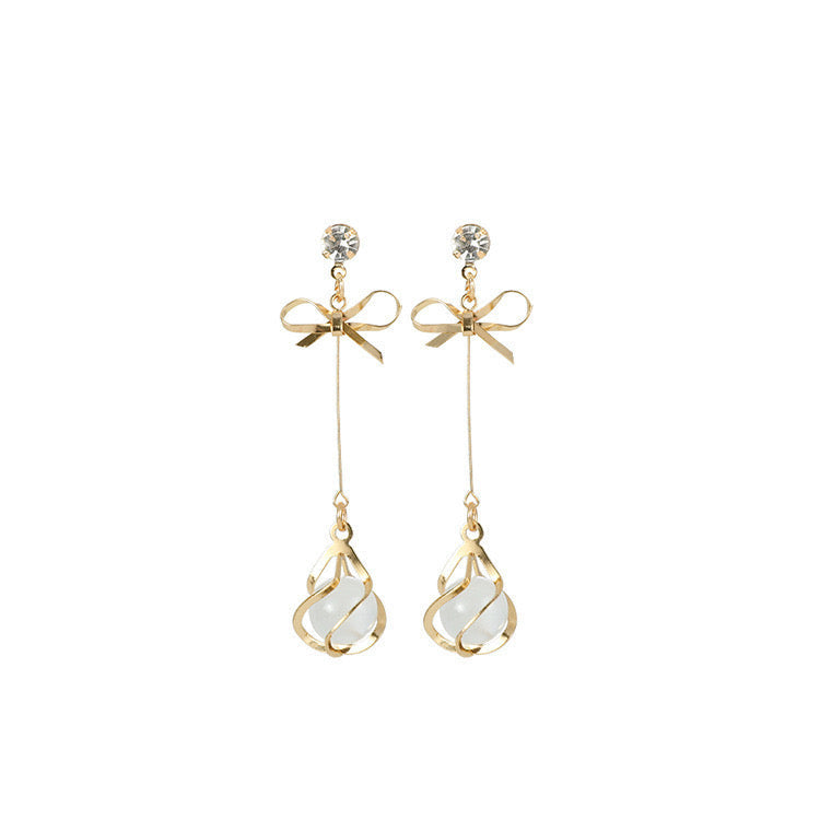 Elegant Bowknot with Opa Long Earrings featuring rhinestones and copper materials, designed for stylish occasions.