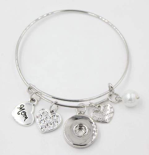 A beautifully crafted themed bangle bracelet featuring charms representing family love, made of brass and zinc alloy.