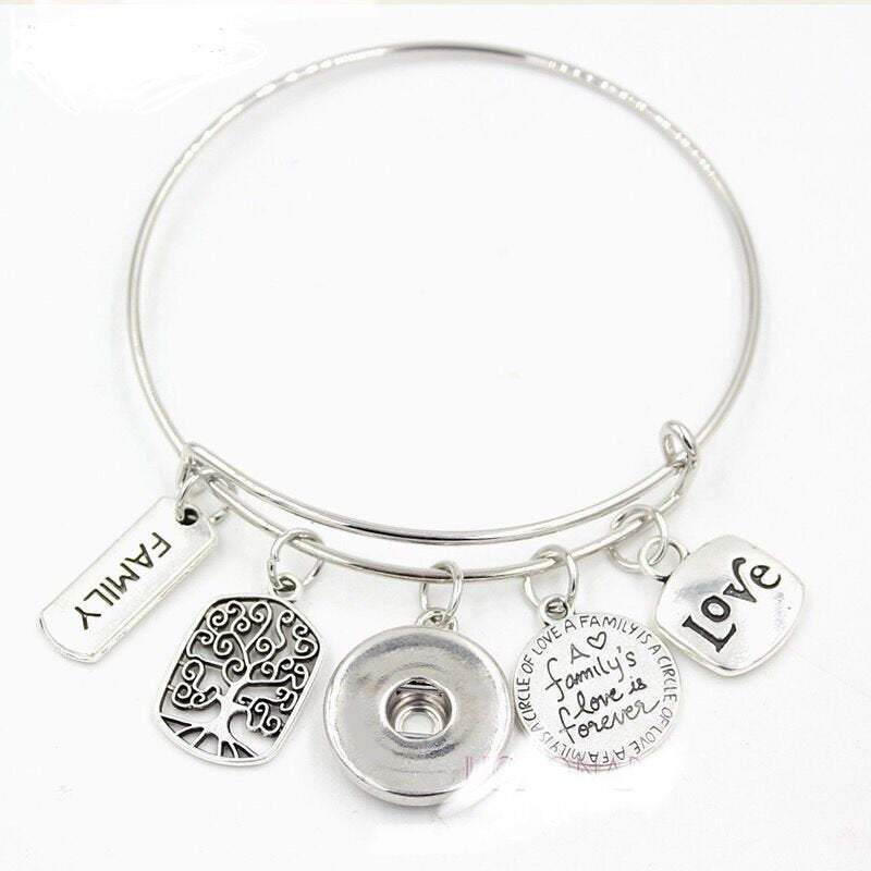 Family Love Tree of Life Bangle Bracelet featuring brass and zinc alloy charms, customizable snap options, and elegant design.