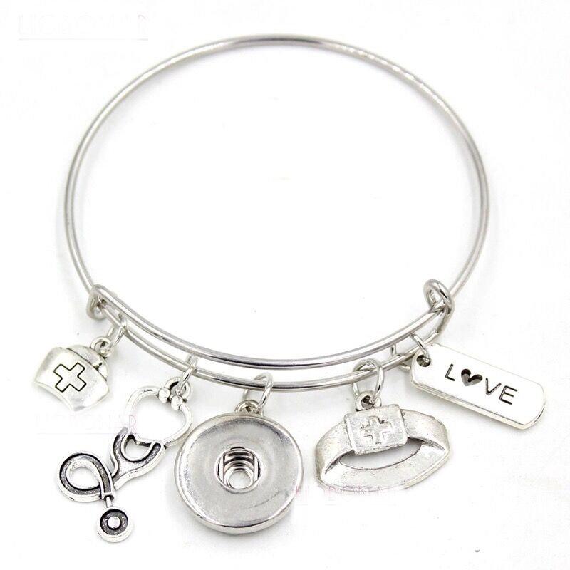 Customizable Nurse-themed bangle bracelet with charms, showcasing a snap base and elegant design.