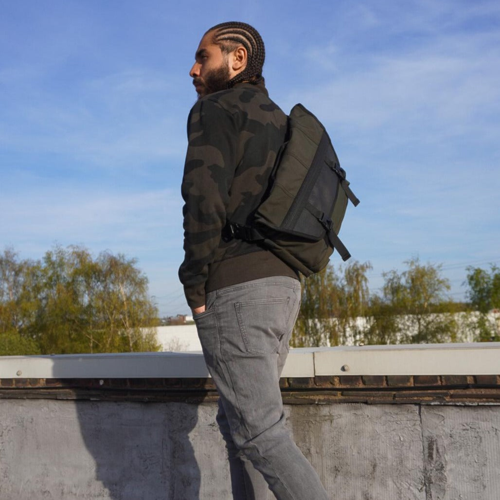 Bradley Upcycled Water Resistant Bike Messenger Bag made from reclaimed materials, featuring adjustable straps and a padded laptop compartment.