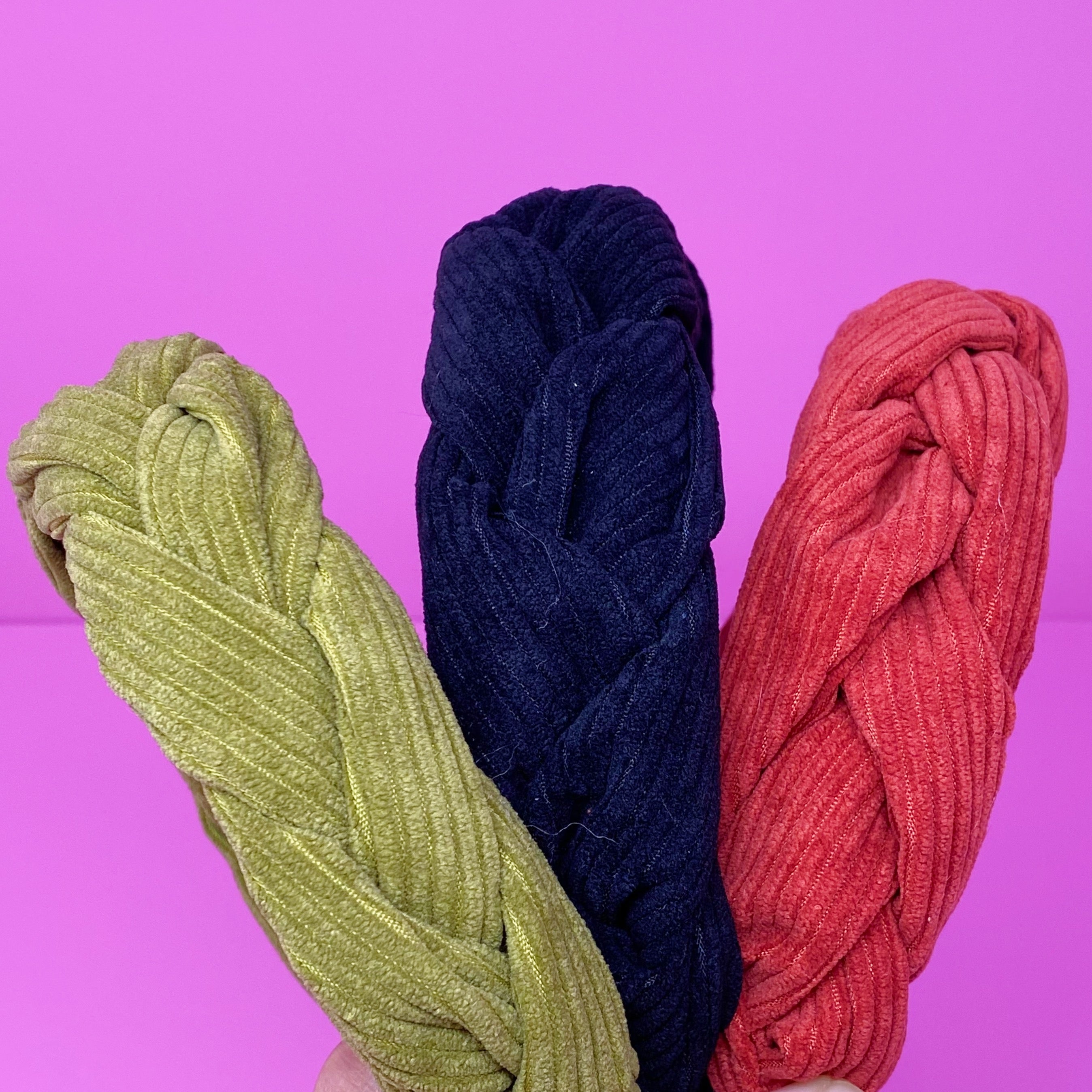 A stylish braided corduroy headband with soft edges, perfect for comfortable wear.