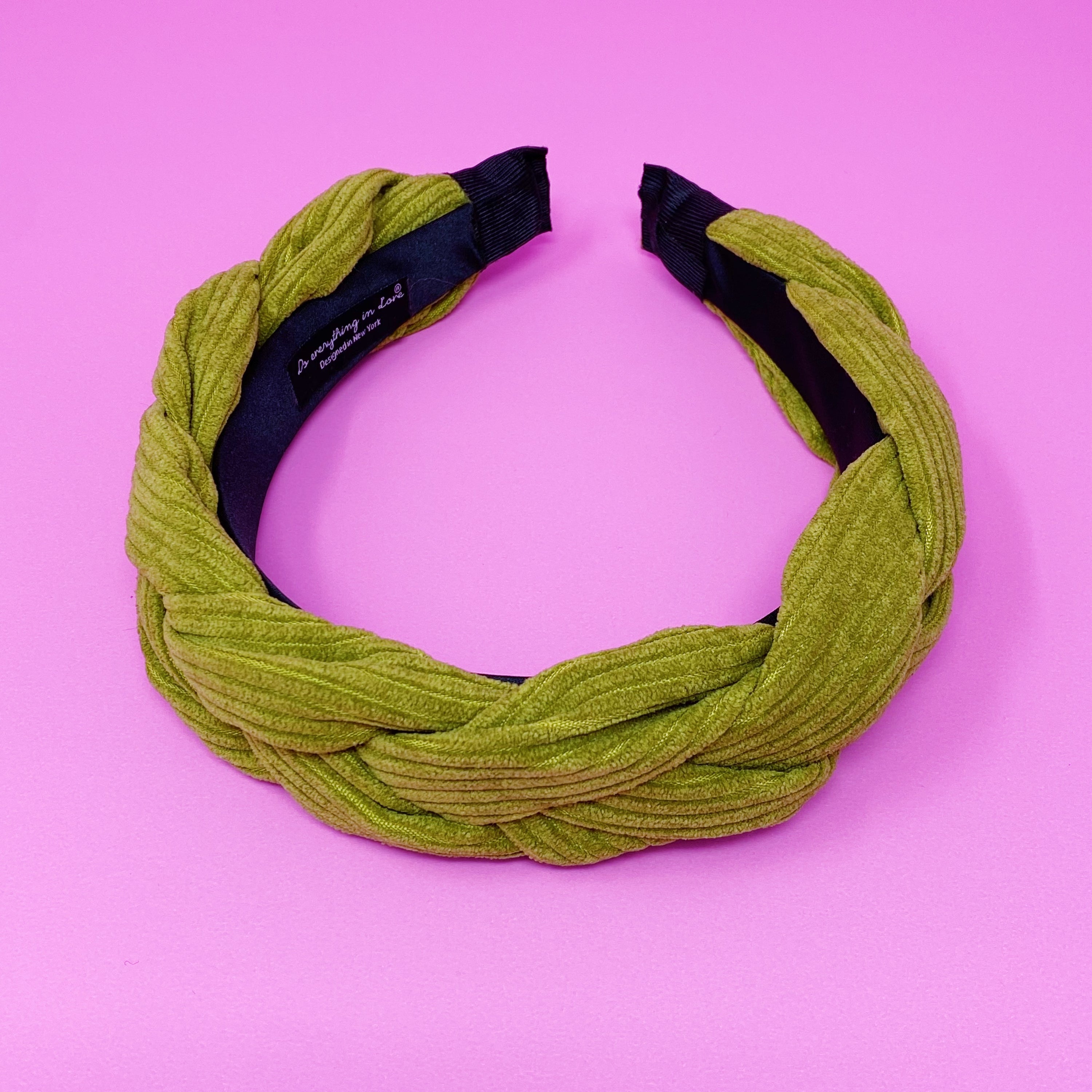 A stylish braided corduroy headband with soft edges, perfect for comfortable wear.